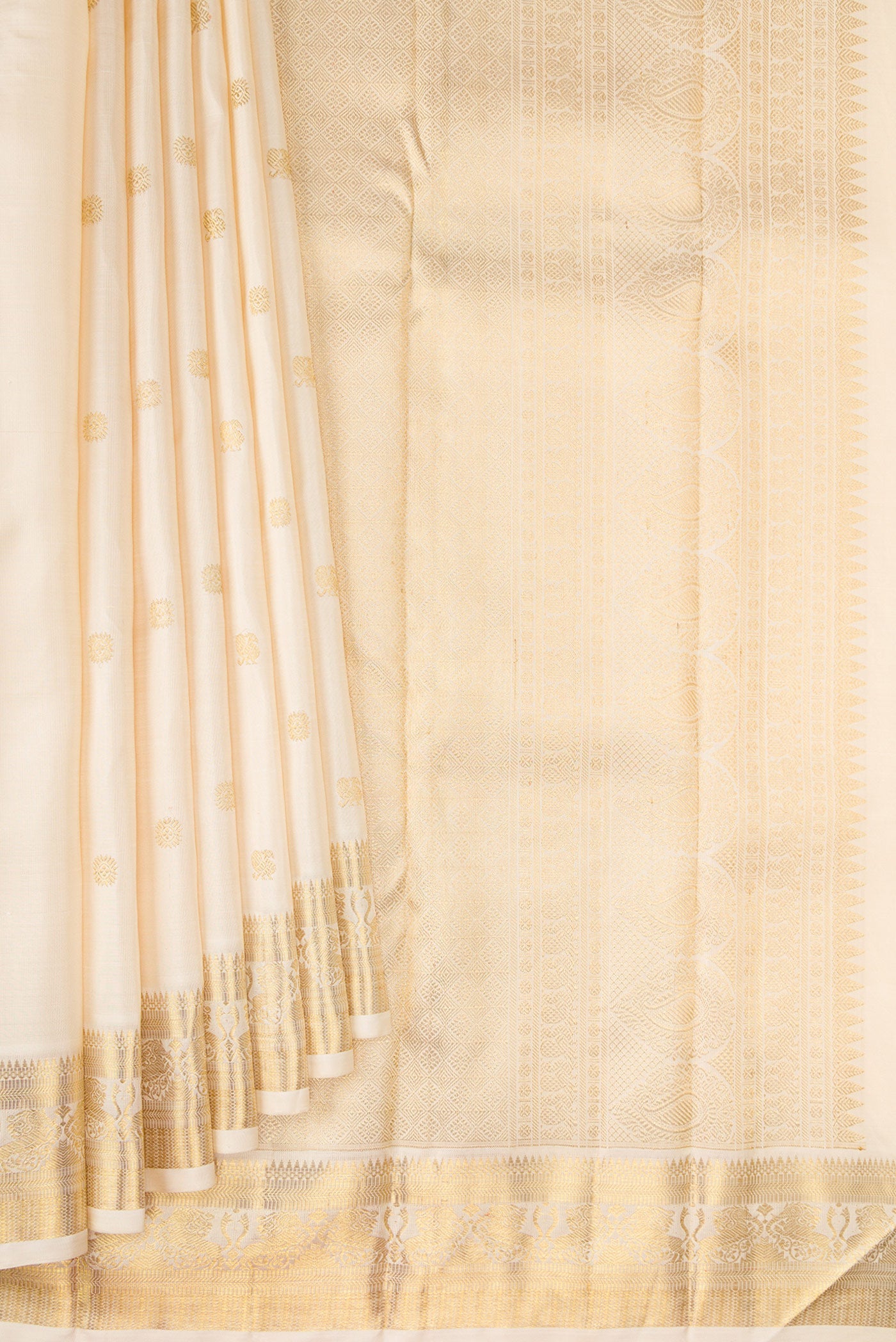 Pleats and pallu of Pure Silk Pure Zari Cream Kanjivaram Saree with Zari Butta on the body and Fancy Border. 