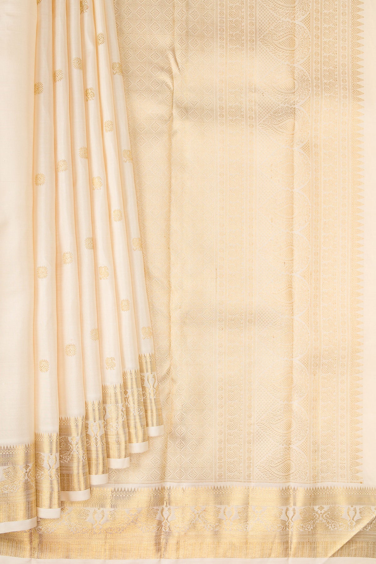 Pleats and pallu of Pure Silk Pure Zari Cream Kanjivaram Saree with Zari Butta on the body and Fancy Border. 