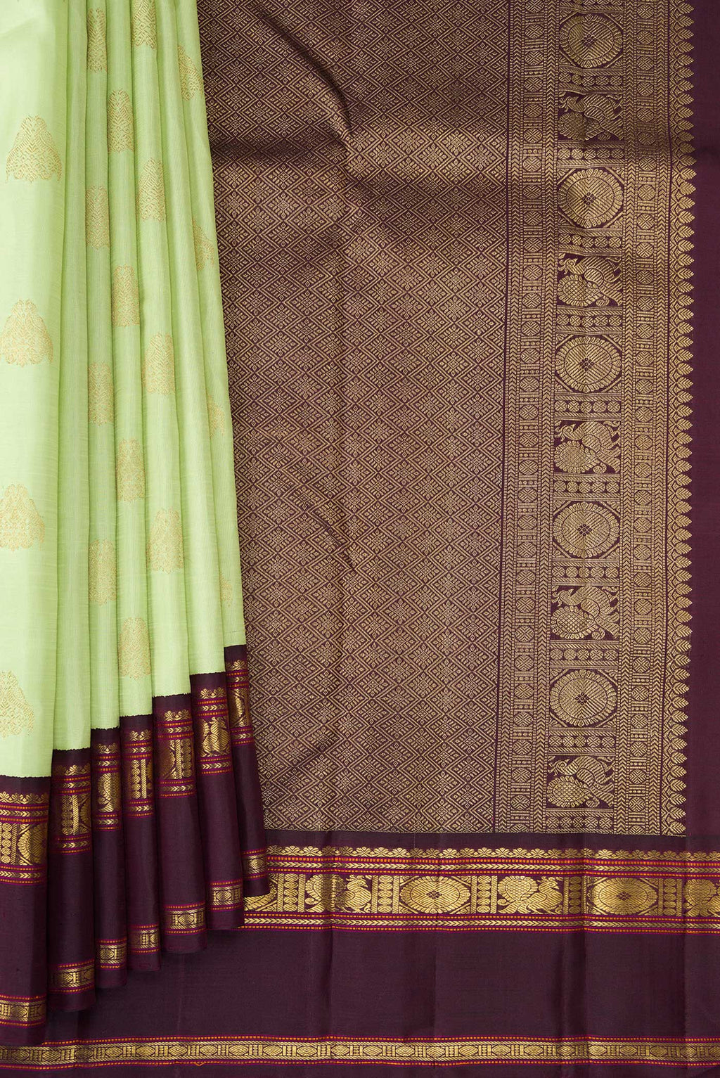 Pleats and pallu of Pure Silk Pure Zari Parrot Green Dual Tone Kanjivaram Saree with Zari Butta on the body and Zari Border. 