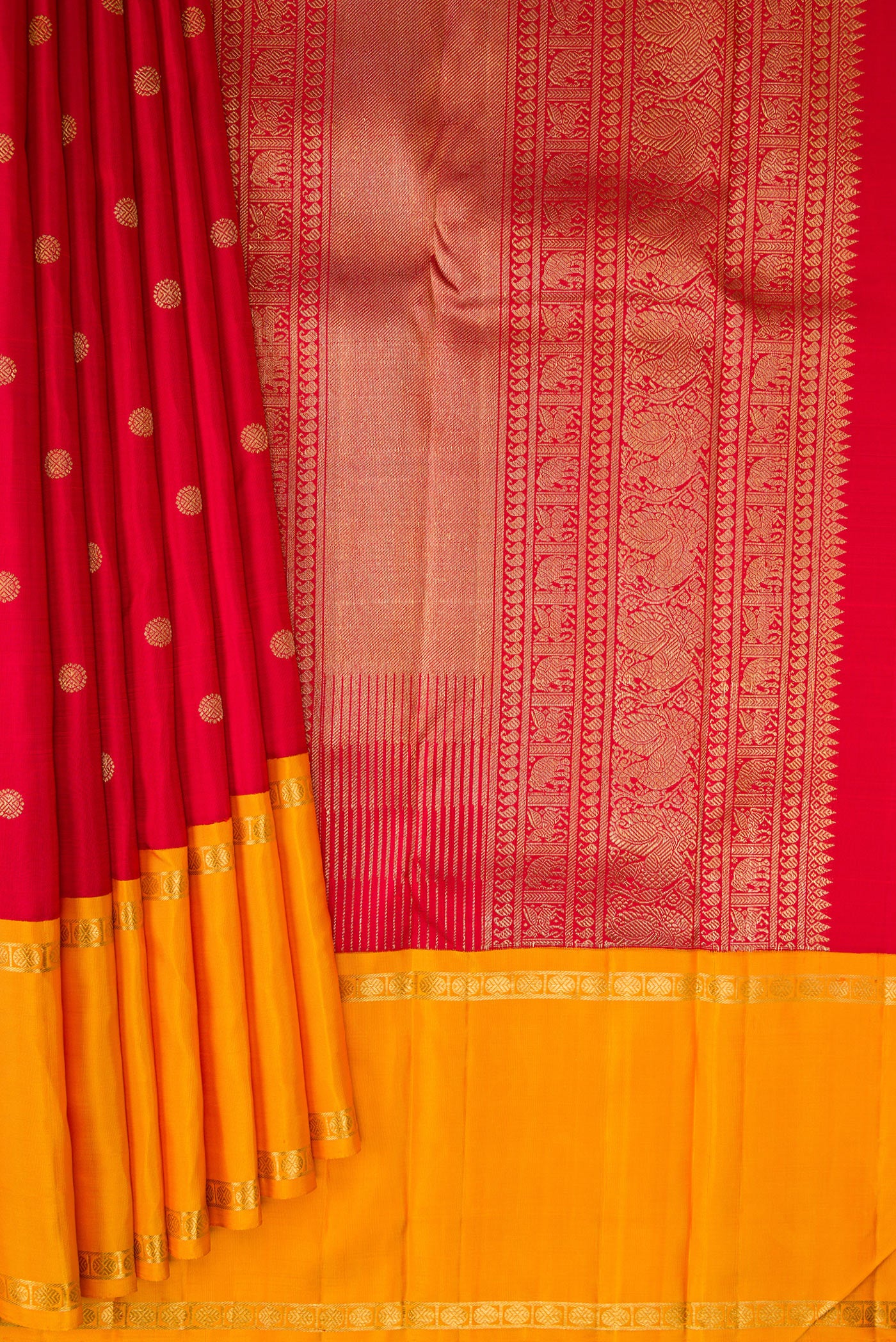 Pleats and pallu of Pure Silk Pure Zari Red Kanjivaram Saree with Zari Butta on the body and Ganga Jamuna Border. 