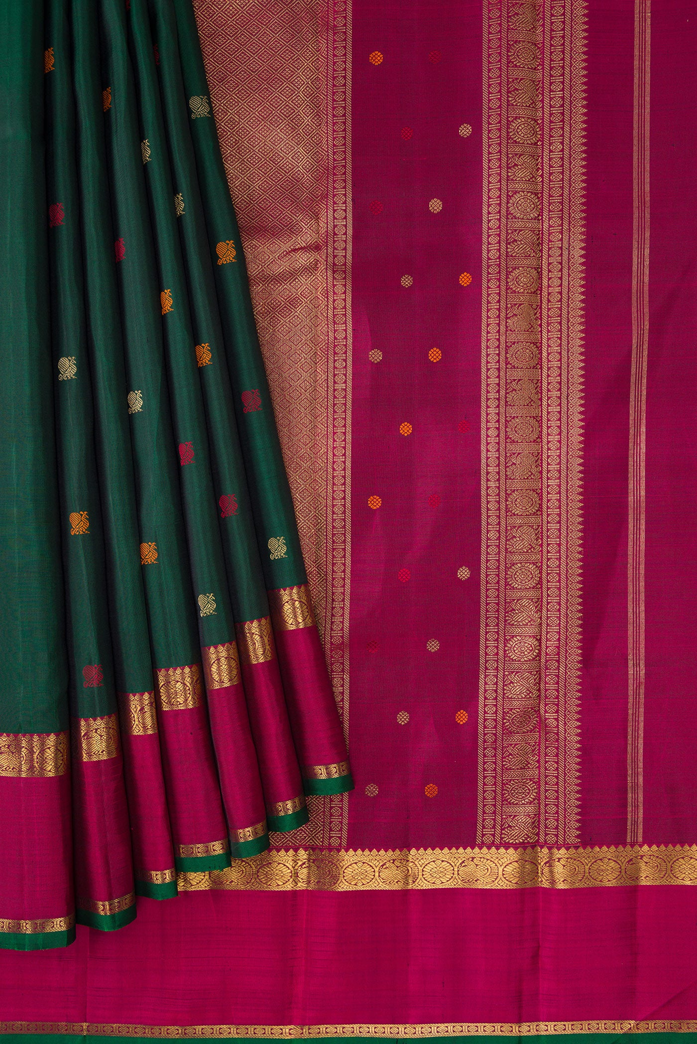 Pleats and pallu of Pure Silk Pure Zari Bottle Green Dual Tone Kanchipuram Saree with Zari And Thread Butta on the body and Zari Border. 