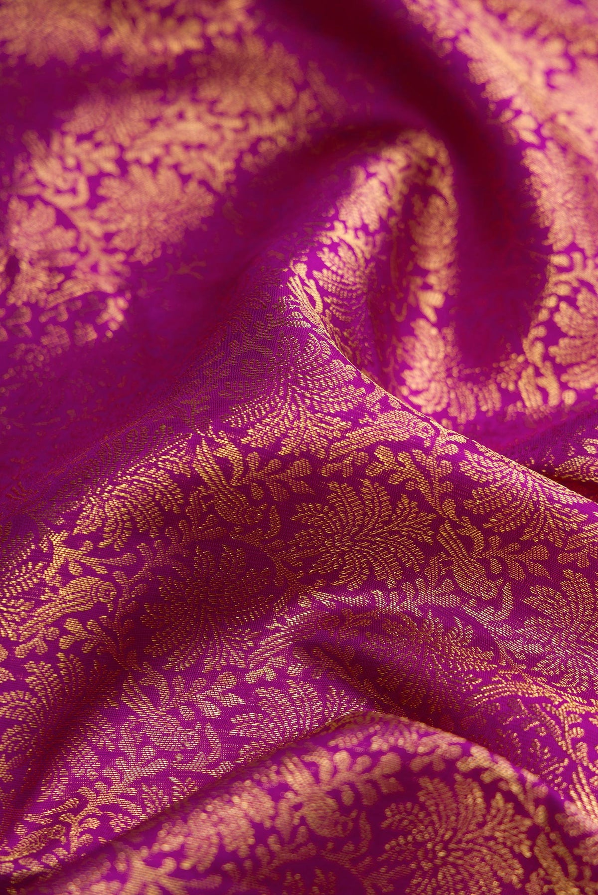 Close up of Purple Dual Tone Kanjivaram Silk Saree with Zari Brocade on the body and Zari Border.  displaying folds