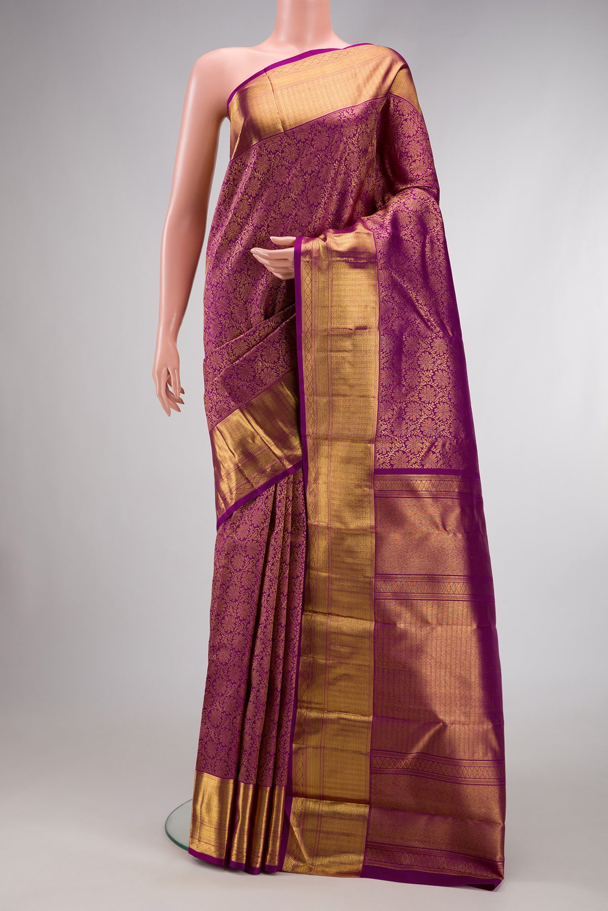 Purple Dual Tone Kanjivaram Silk Saree with Zari Brocade on the body and Zari Border.  displayed on a mannequin