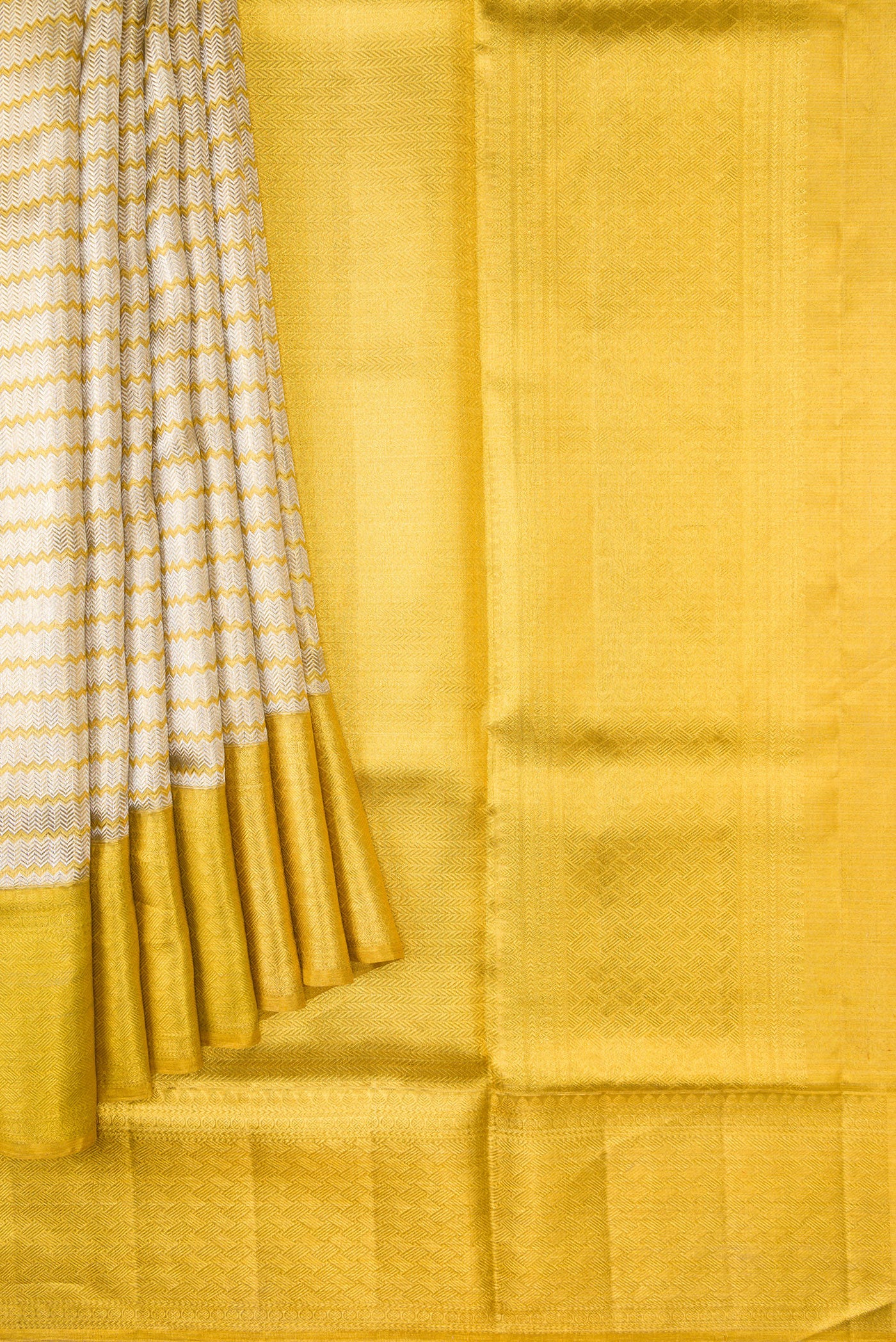 Pleats and pallu of Silver Dual Tone Kanjivaram Tissue Silk Saree with Zari Brocade on the body and Zari Border. 
