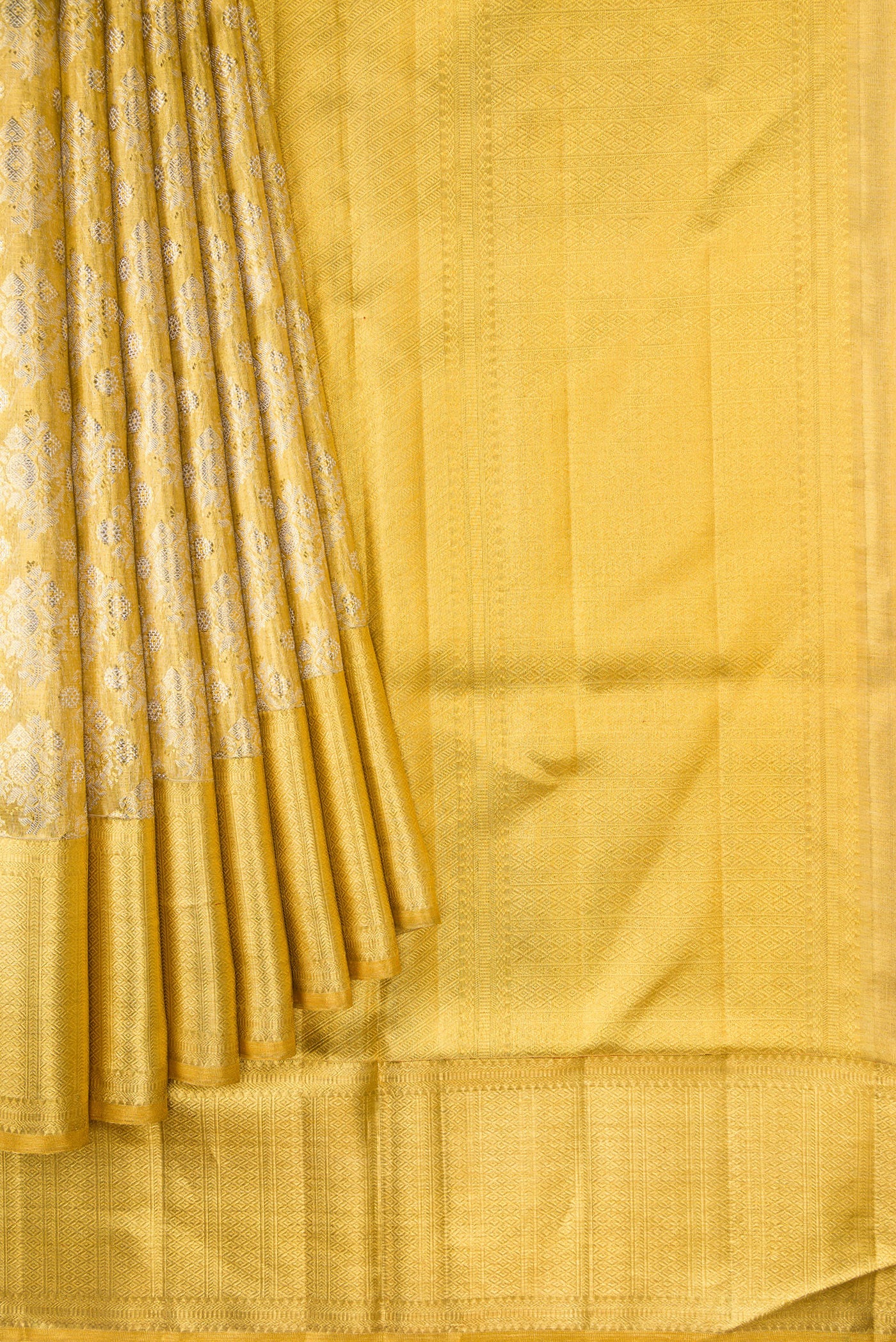 Pleats and pallu of Gold Dual Tone Kanjivaram Tissue Silk Saree with Zari Brocade on the body and Zari Border. 