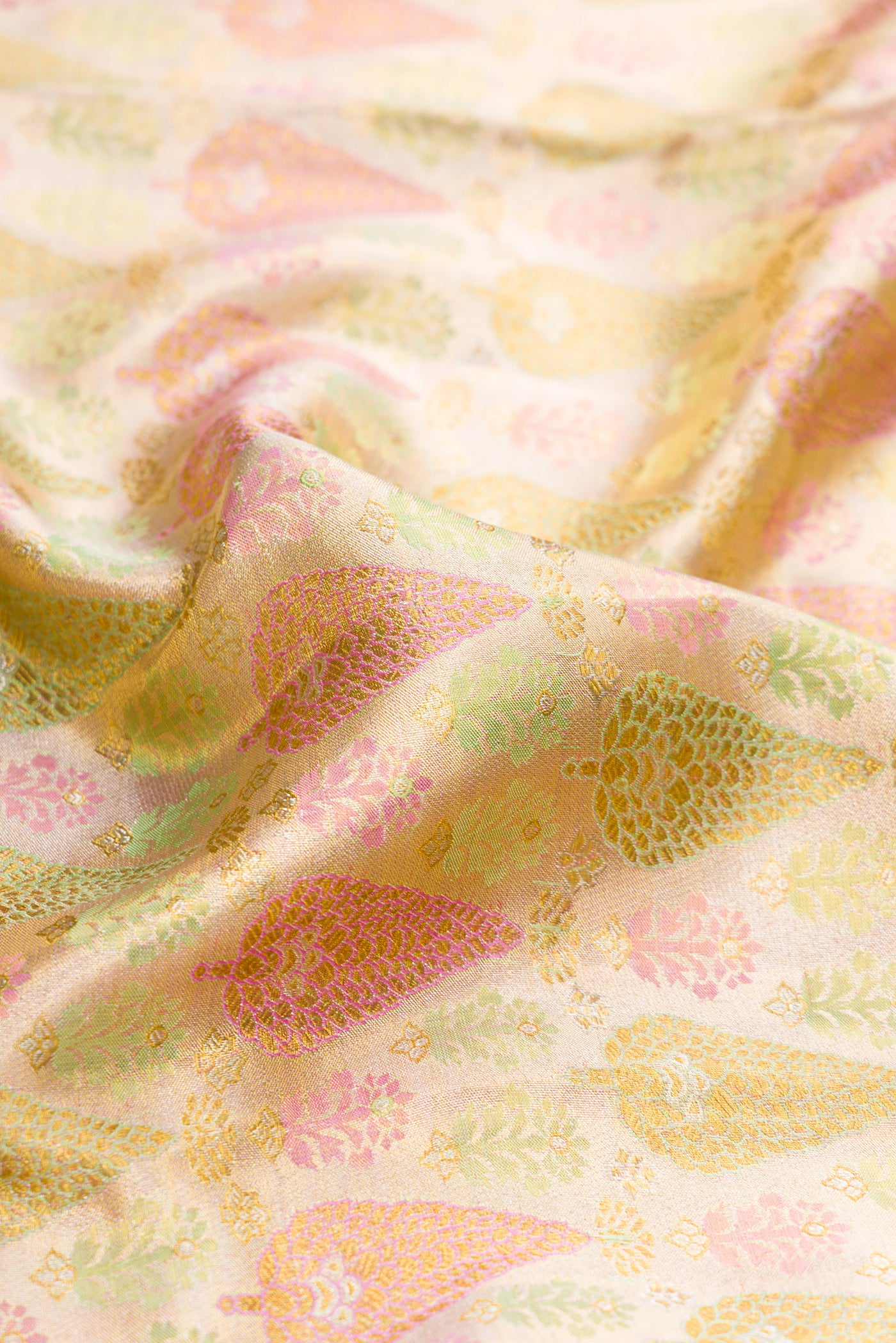 Close up of Gold Dual Tone Kanjivaram Tissue Silk Saree with Zari Brocade on the body and Zari Border.  displaying folds