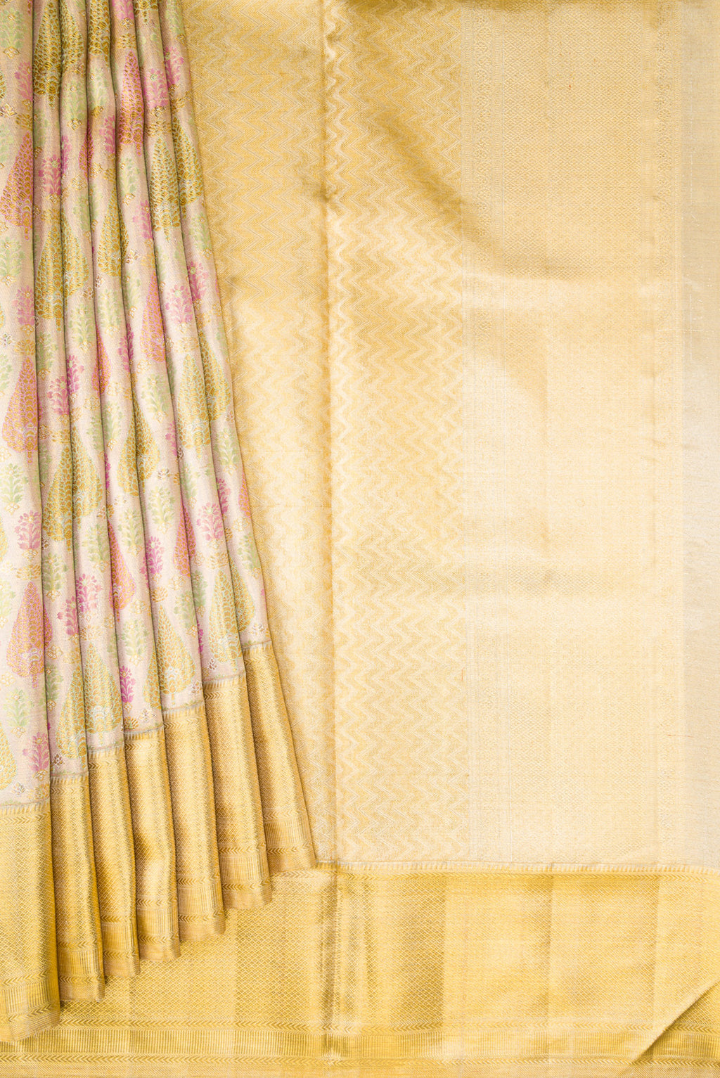 Pleats and pallu of Gold Dual Tone Kanjivaram Tissue Silk Saree with Zari Brocade on the body and Zari Border. 