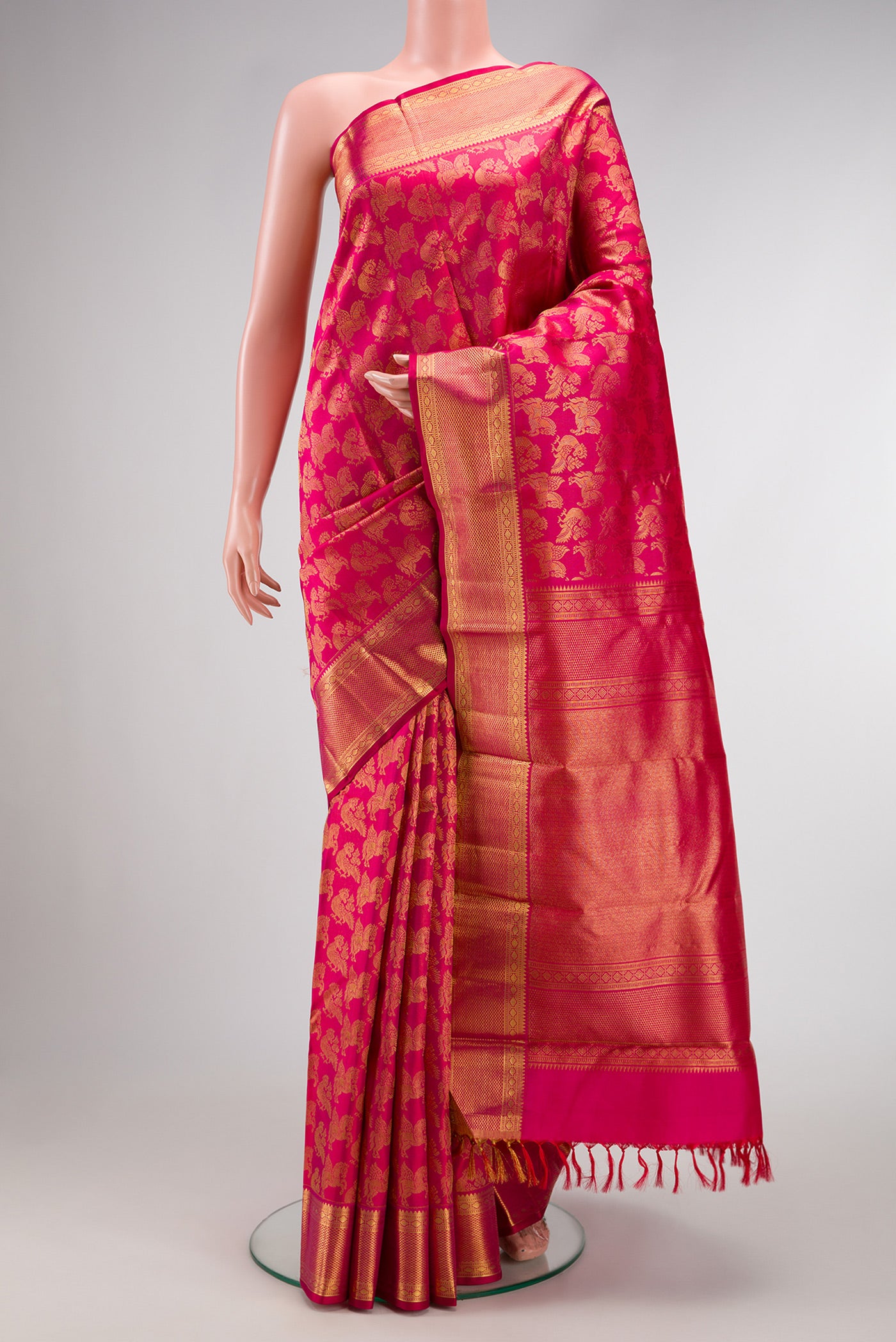 Pink Dual Tone Kanchipuram Silk Saree with Zari Brocade on the body and Zari Border.  displayed on a mannequin