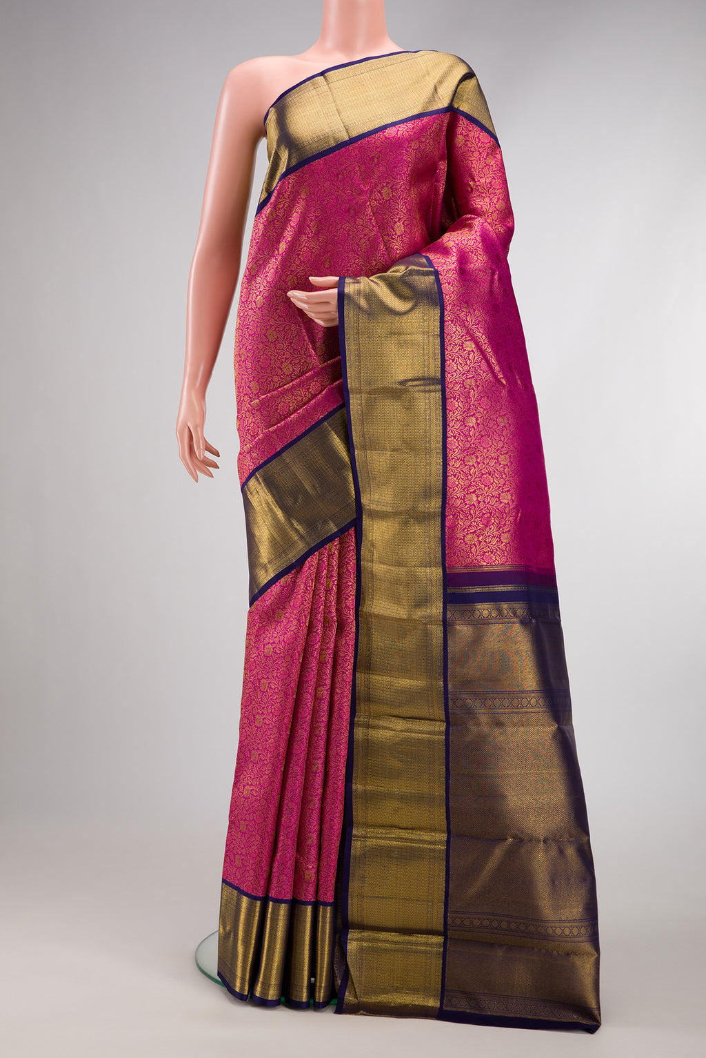 Pink Dual Tone Kanjivaram Silk Saree with Zari Brocade on the body and Zari Border.  displayed on a mannequin