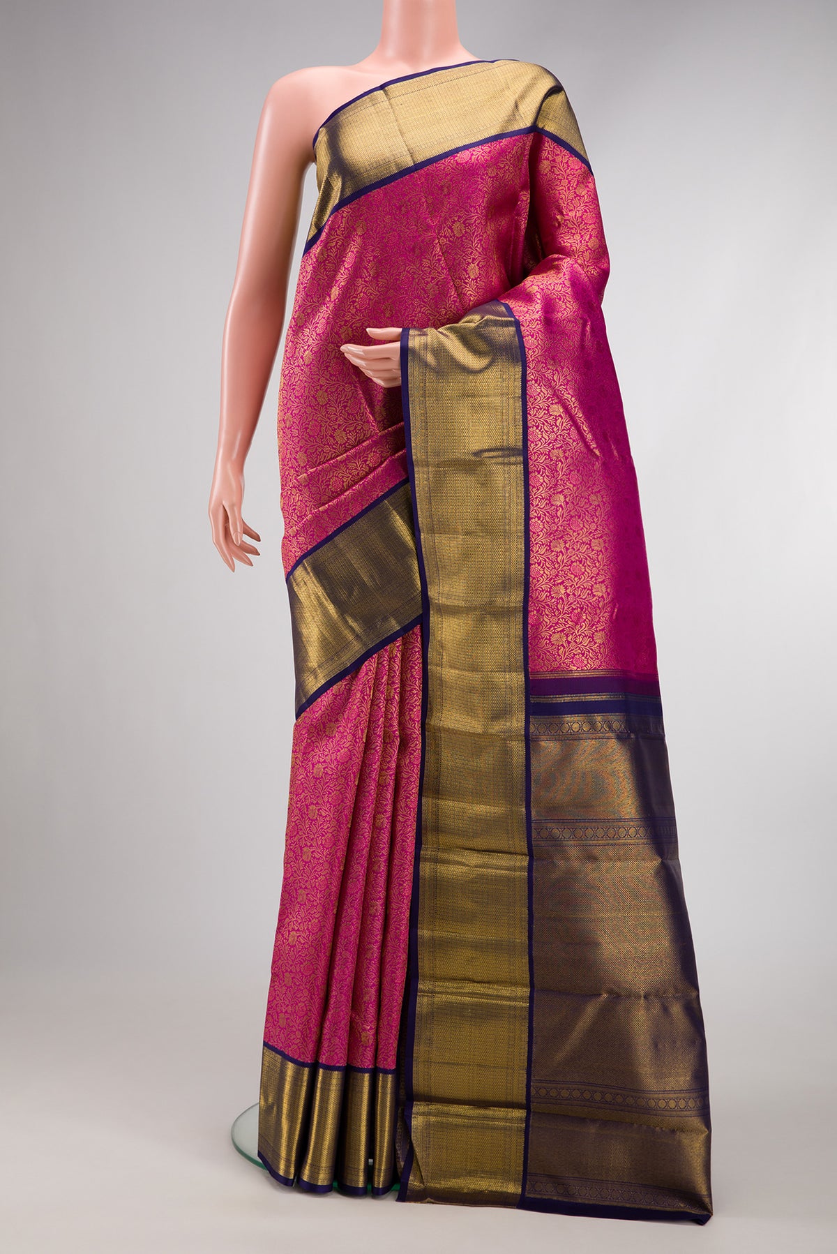 Pink Dual Tone Kanjivaram Silk Saree with Zari Brocade on the body and Zari Border.  displayed on a mannequin