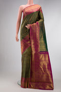 Green Dual Tone Kanchipuram Silk Saree with Zari Brocade on the body and Zari Border.  displayed on a mannequin