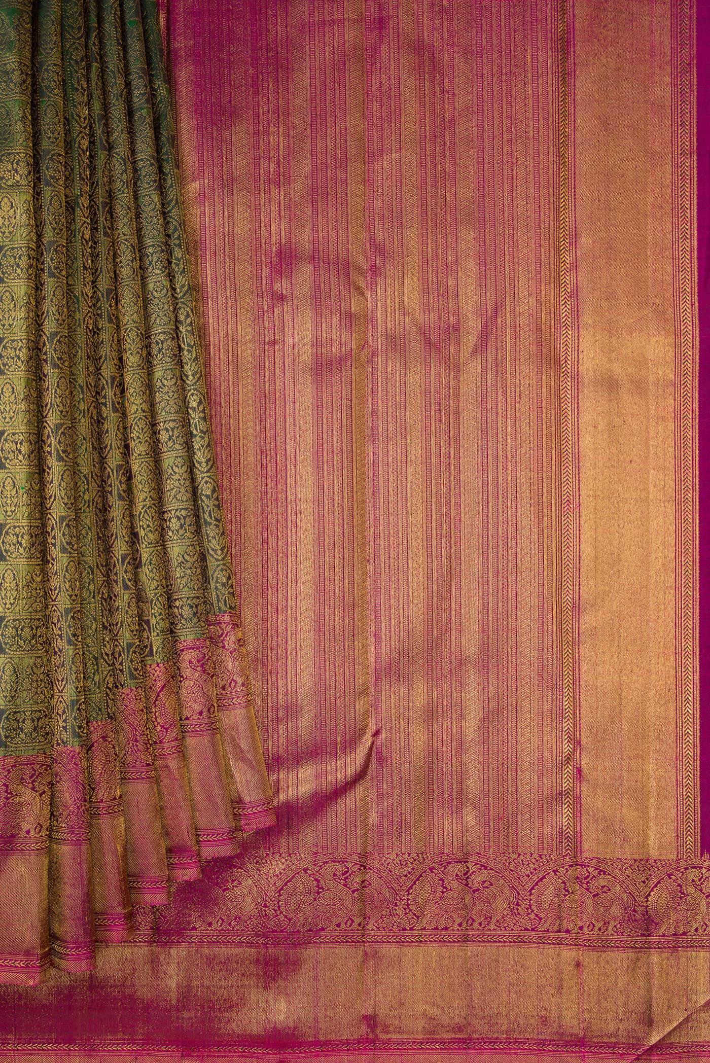 Pleats and pallu of Green Dual Tone Kanchipuram Silk Saree with Zari Brocade on the body and Zari Border. 