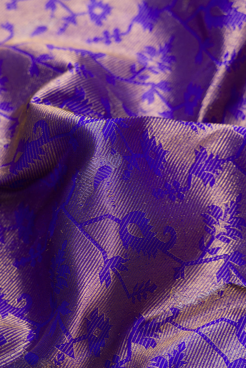 Close up of Royal Blue Dual Tone Kanchipuram Silk Saree with Zari Brocade on the body and Zari Border.  displaying folds