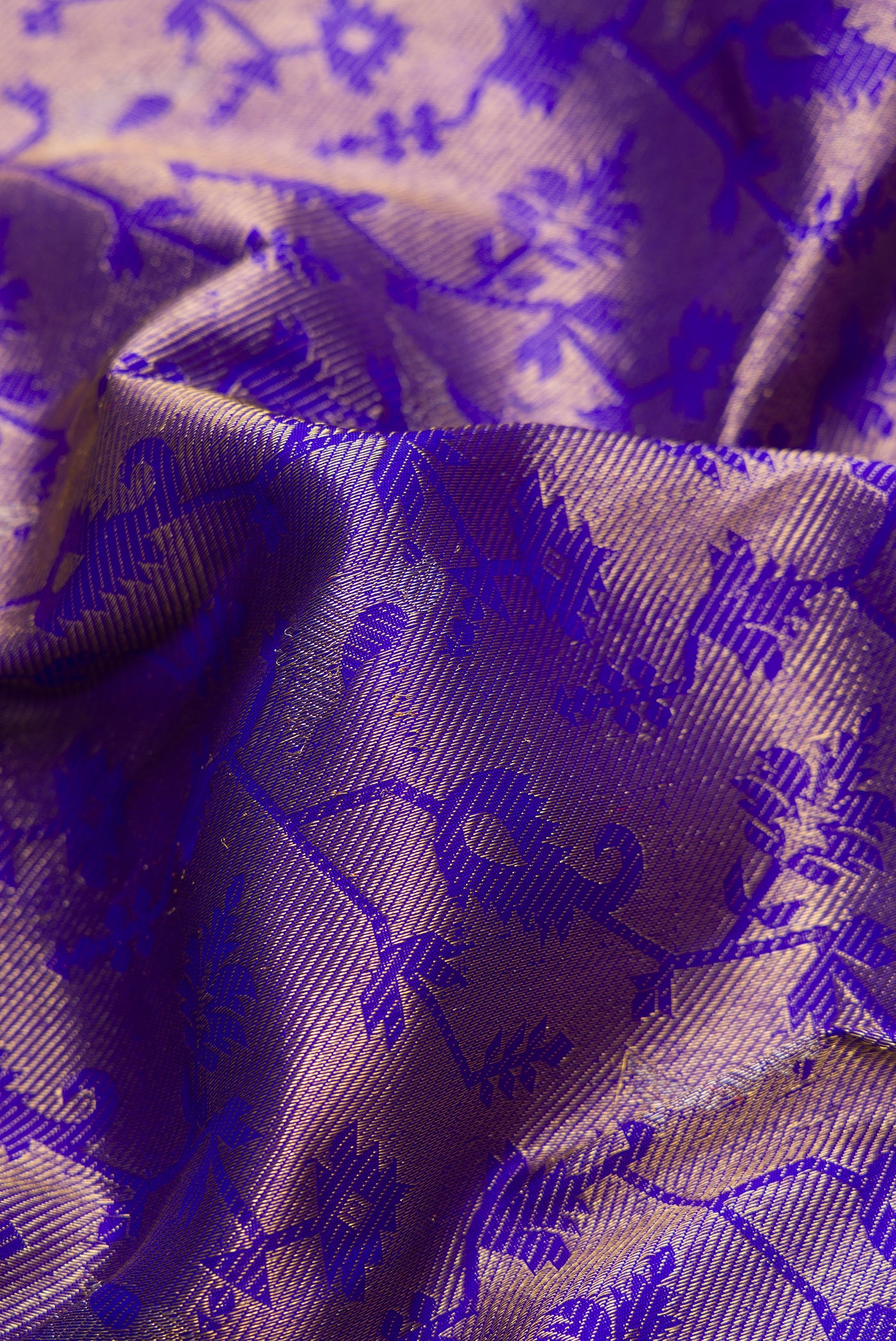 Close up of Royal Blue Dual Tone Kanchipuram Silk Saree with Zari Brocade on the body and Zari Border.  displaying folds