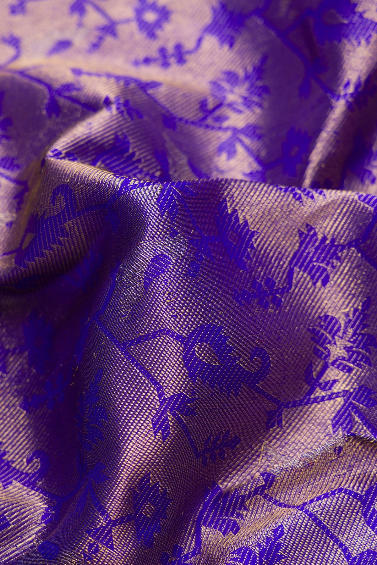 Close up of Royal Blue Dual Tone Kanchipuram Silk Saree with Zari Brocade on the body and Zari Border.  displaying folds