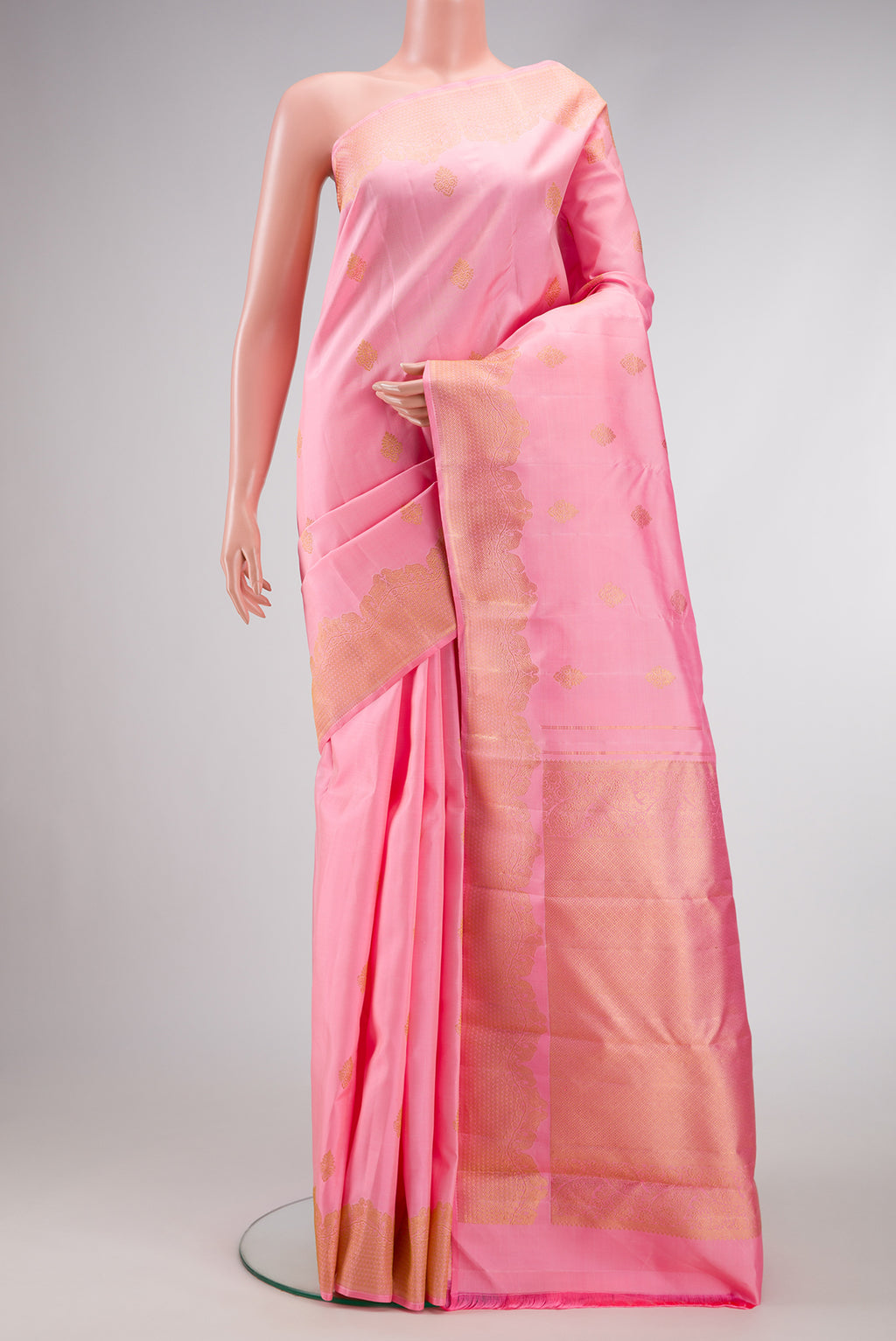 Pink Dual Tone Kanjivaram Silk Saree with Zari Butta on the body and Fancy Border.  displayed on a mannequin