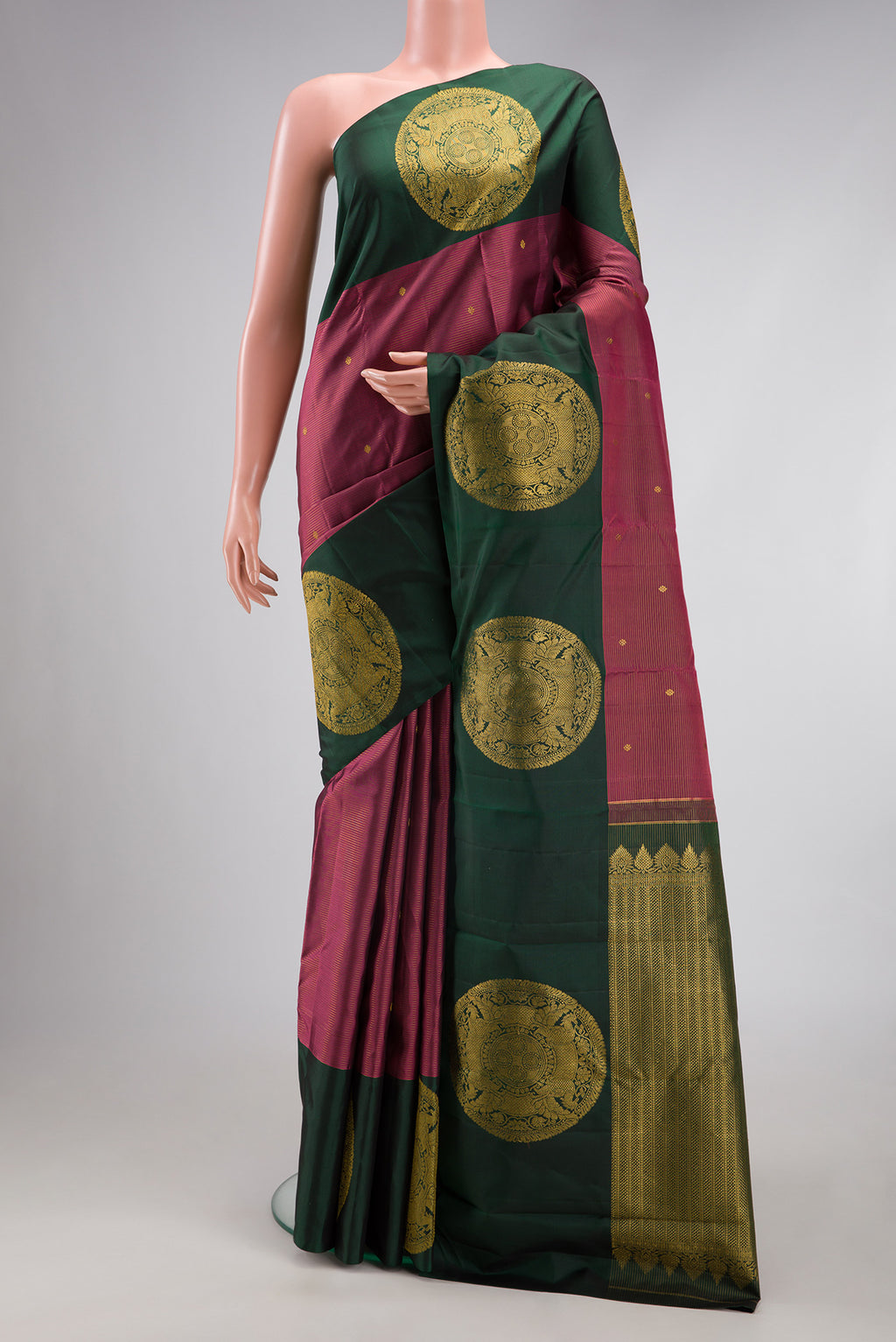 Rose Gold Dual Tone Kanjivaram Silk Saree with Stripes on the body and Fancy Border.  displayed on a mannequin