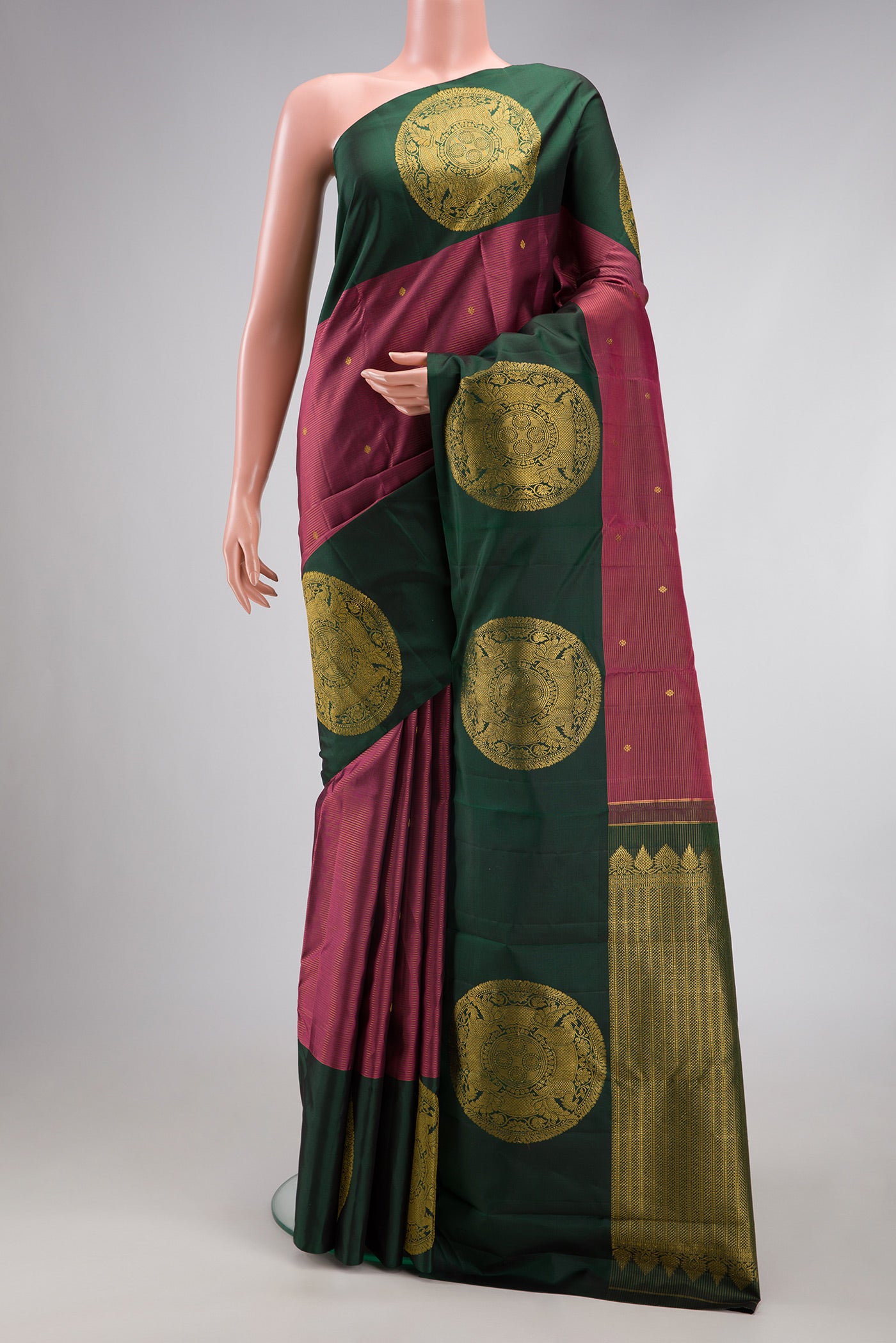 Rose Gold Dual Tone Kanjivaram Silk Saree with Stripes on the body and Fancy Border.  displayed on a mannequin