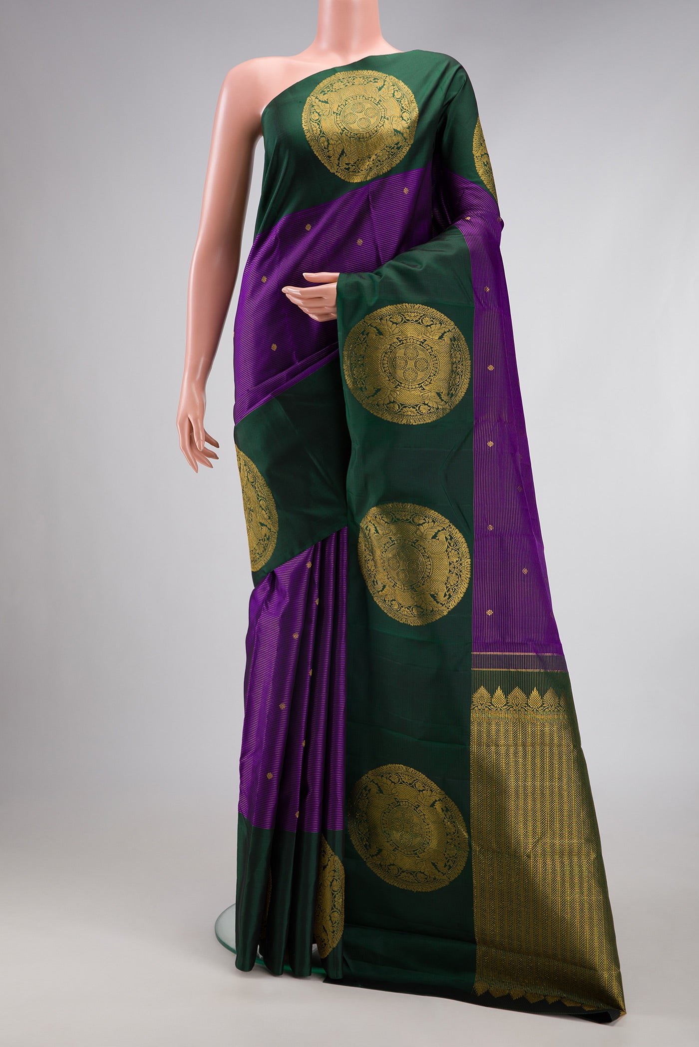 Violet Kanjivaram Silk Saree with Stripes on the body and Fancy Border.  displayed on a mannequin
