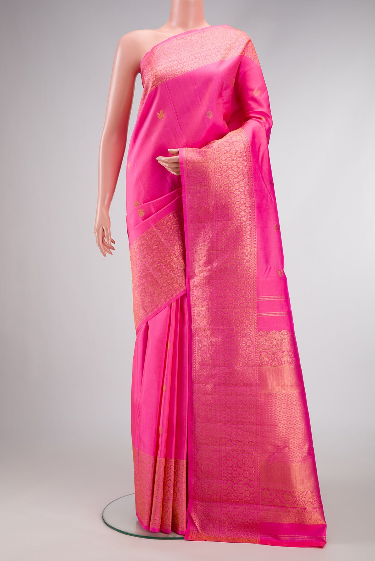 Pink Dual Tone Kanjivaram Silk Saree with Zari Butta on the body and Fancy Border.  displayed on a mannequin
