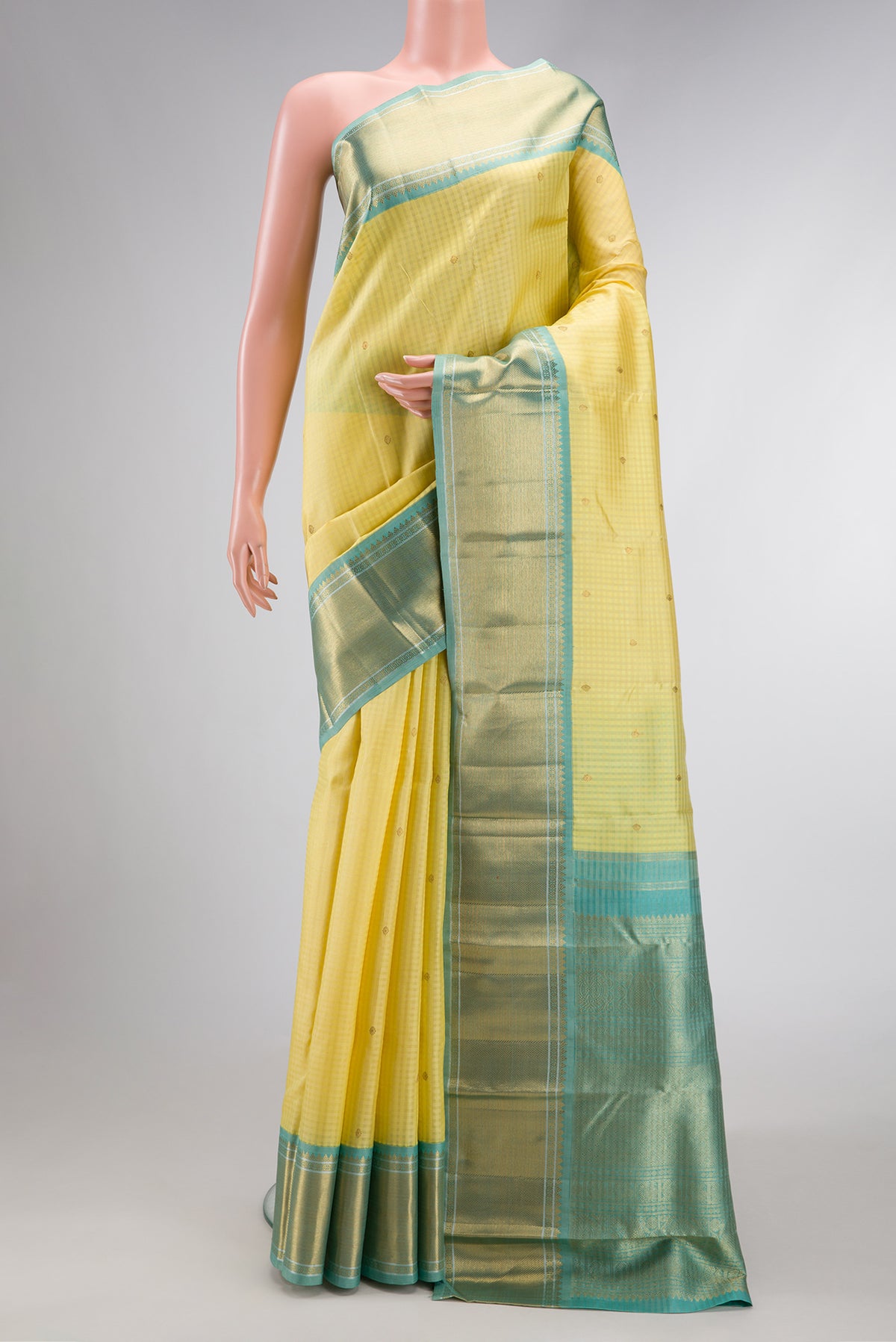 Pure Silk Pure Zari Sandal Dual Tone Kanjivaram Saree with Checked design on the body and Zari Border.  displayed on a mannequin