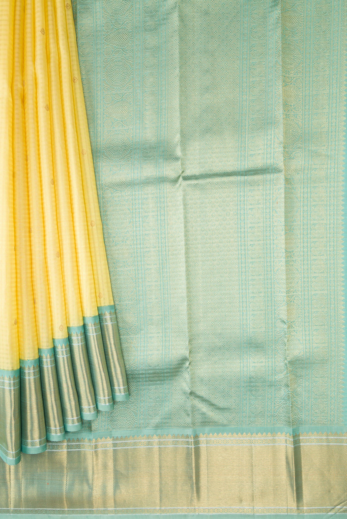 Pleats and pallu of Pure Silk Pure Zari Sandal Dual Tone Kanjivaram Saree with Checked design on the body and Zari Border. 