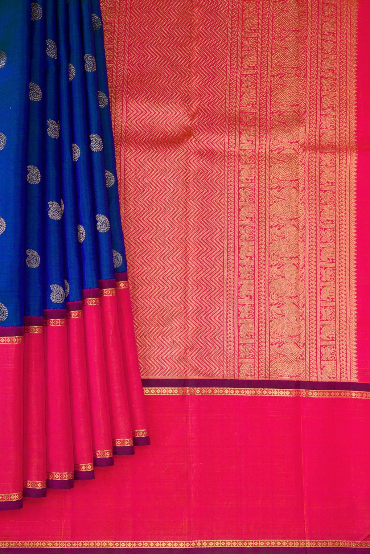 Pleats and pallu of Pure Silk Pure Zari Peacock Blue Dual Tone Kanjivaram Saree with Zari Butta on the body and Zari Border. 