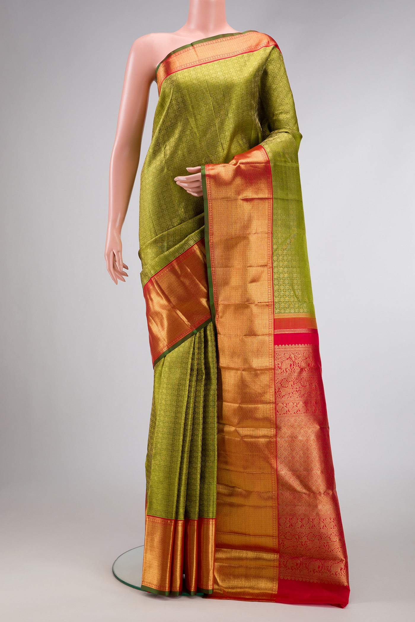 Pure Silk Pure Zari Green Dual Tone Kanjivaram Saree with Zari Brocade on the body and Zari Border.  displayed on a mannequin