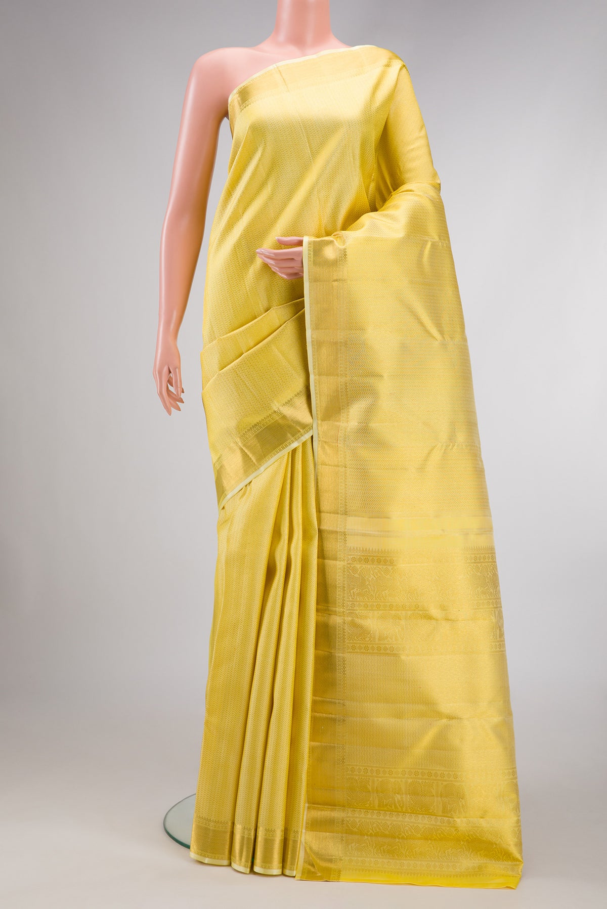 Lemon Yellow Dual Tone Kanjivaram Silk Saree with Zari Brocade on the body and Zari Border.  displayed on a mannequin