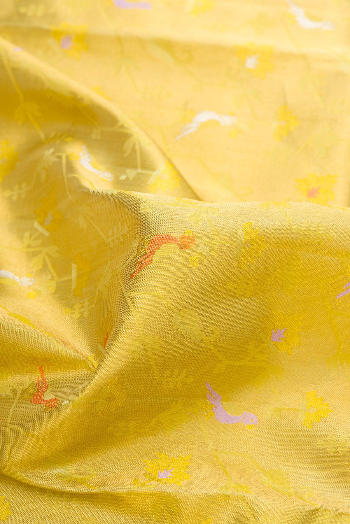 Close up of Pure Silk Pure Zari Pista Green Dual Tone Kanjivaram Saree with Zari Brocade on the body and Zari Border.  displaying folds