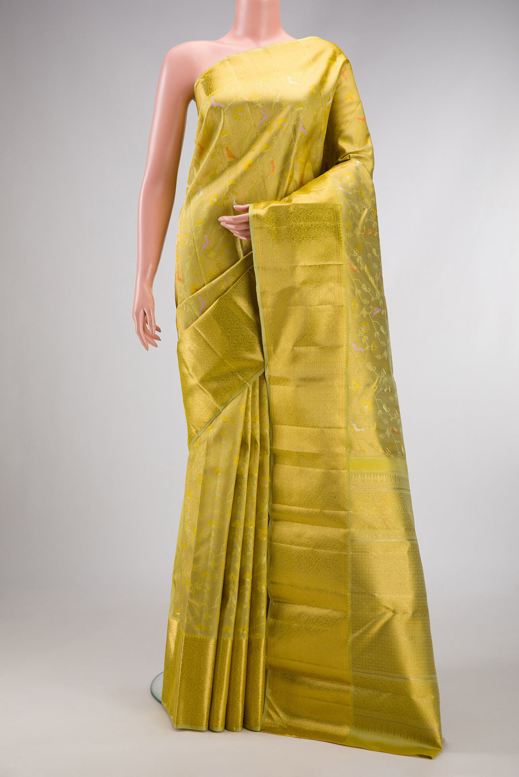 Pure Silk Pure Zari Pista Green Dual Tone Kanjivaram Saree with Zari Brocade on the body and Zari Border.  displayed on a mannequin