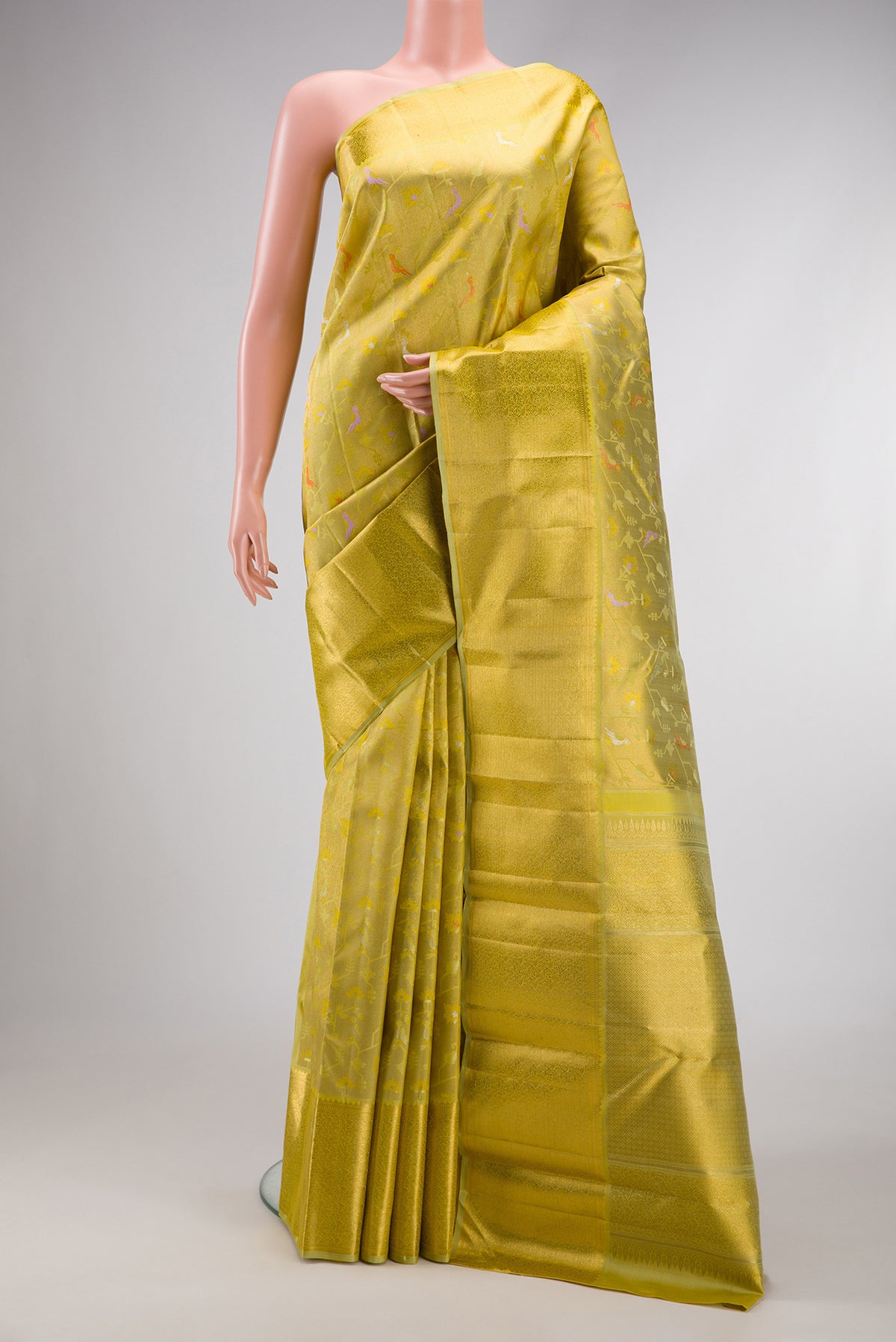 Pure Silk Pure Zari Pista Green Dual Tone Kanjivaram Saree with Zari Brocade on the body and Zari Border.  displayed on a mannequin