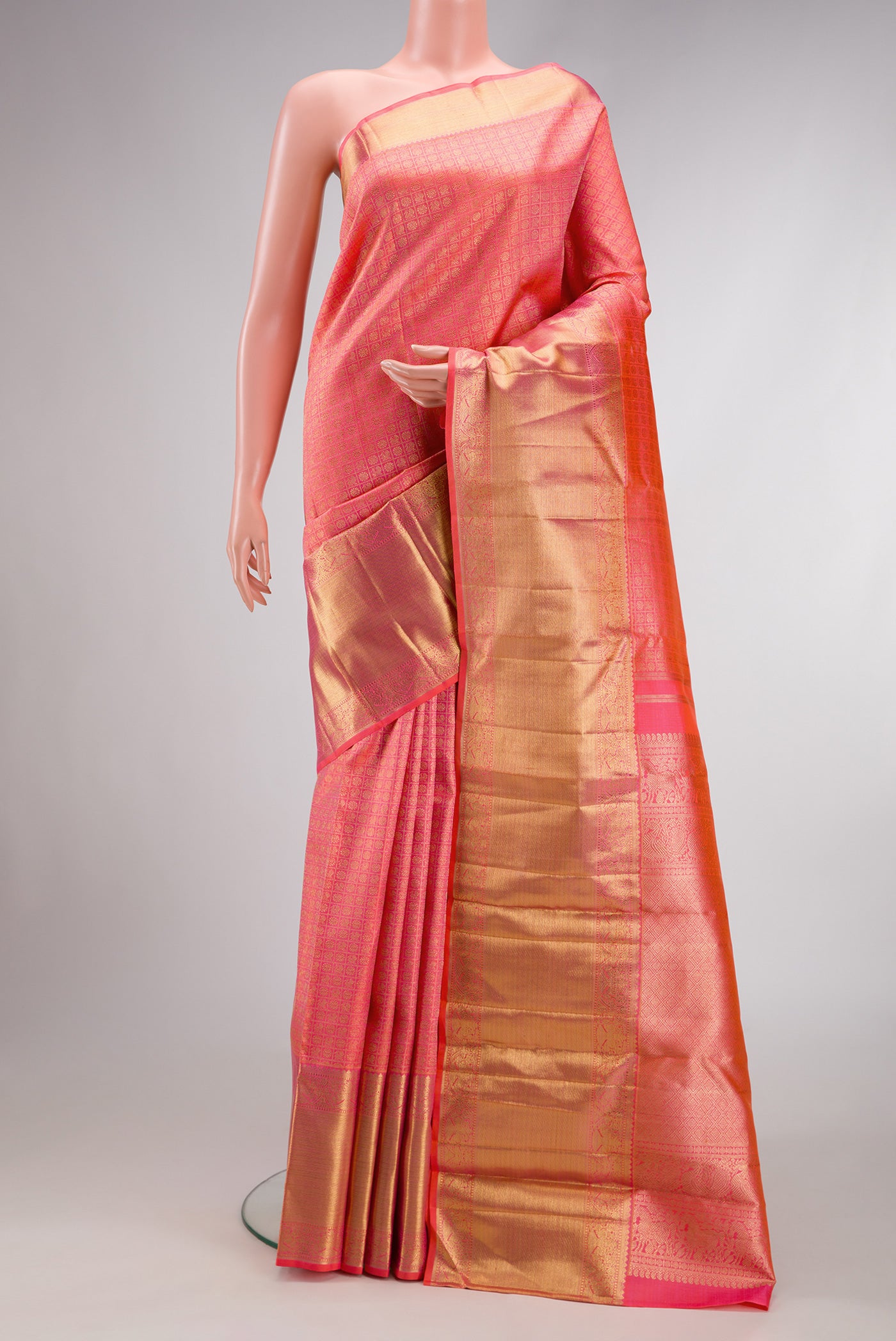 Pure Silk Pure Zari Pink Dual Tone Kanjivaram Saree with Zari Brocade on the body and Zari Border.  displayed on a mannequin
