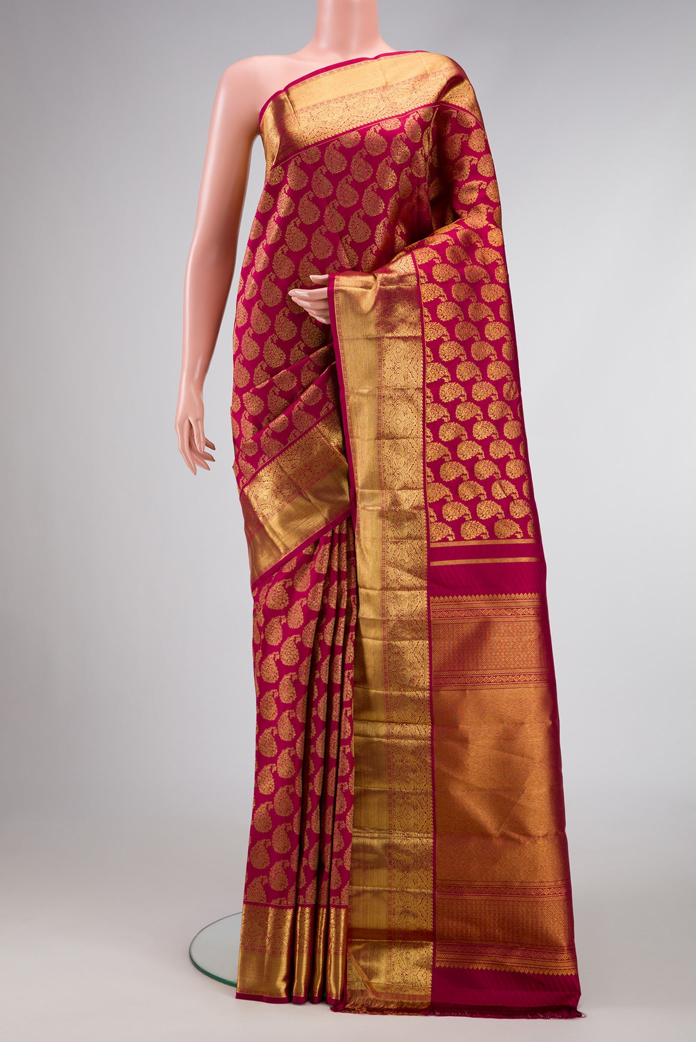 Maroon Dual Tone Kanjivaram Silk Saree with Zari Brocade on the body and Zari Border.  displayed on a mannequin