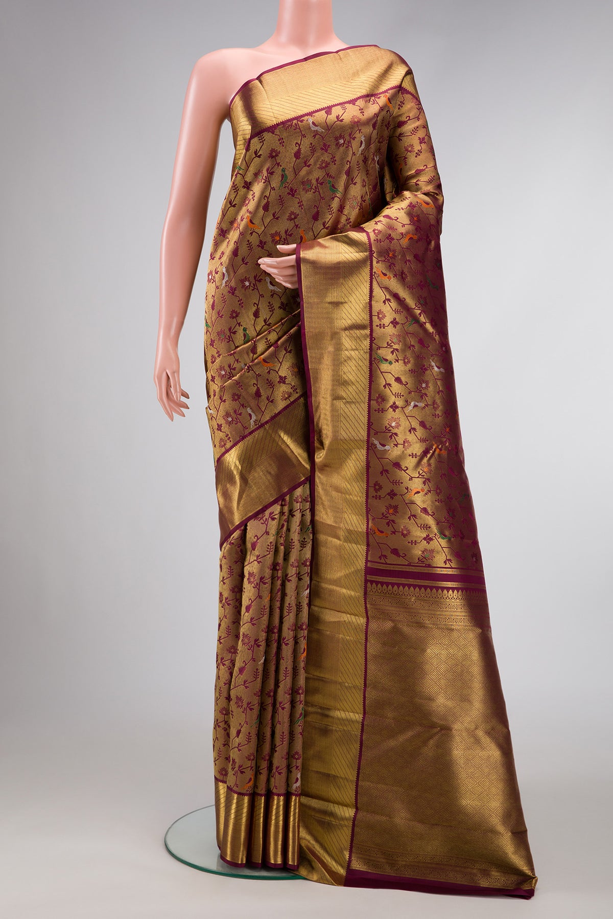 Pure Silk Pure Zari Burgundy Dual Tone Kanjivaram Saree with Zari Brocade on the body and Zari Border.  displayed on a mannequin