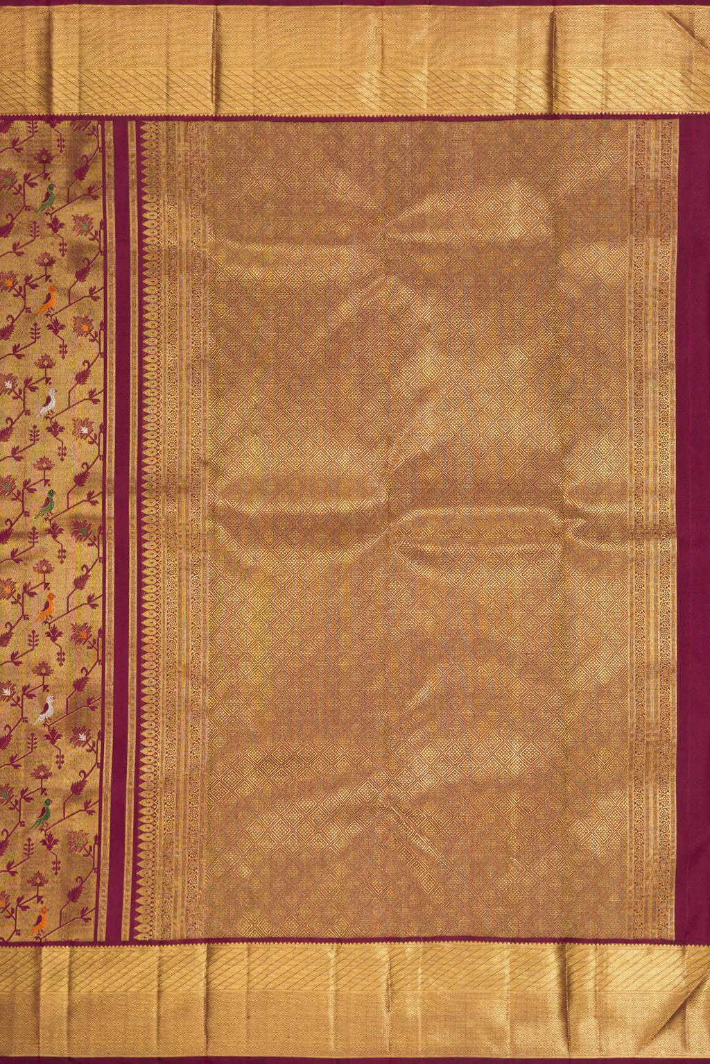 Close up image of the pallu of Pure Silk Pure Zari Burgundy Dual Tone Kanjivaram Saree with Zari Brocade on the body and Zari Border. 