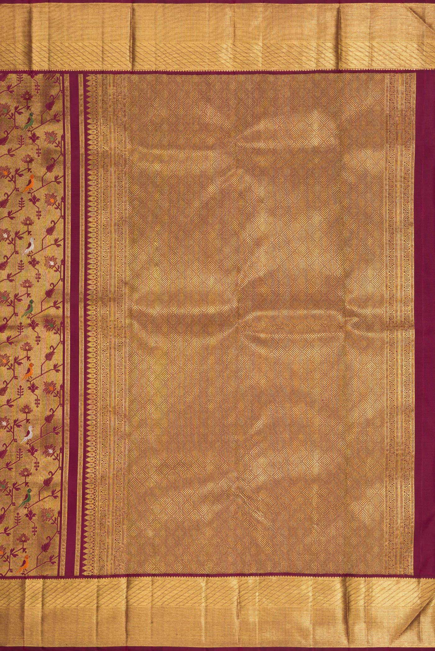 Close up image of the pallu of Pure Silk Pure Zari Burgundy Dual Tone Kanjivaram Saree with Zari Brocade on the body and Zari Border. 