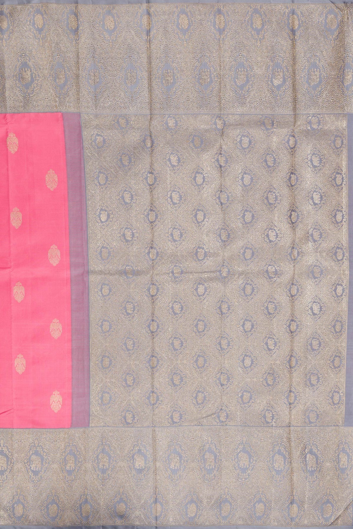 Close up image of the pallu of Pure Silk Pure Zari Pink Kanjivaram Saree with Zari Butta on the body and Fancy Border. 