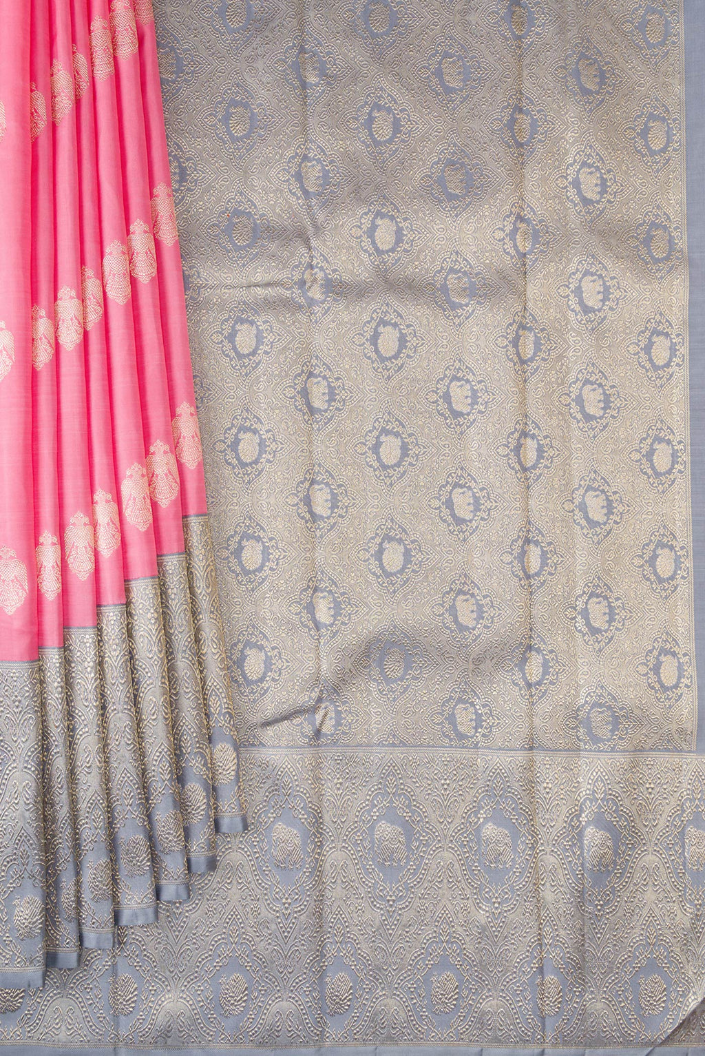 Pleats and pallu of Pure Silk Pure Zari Pink Kanjivaram Saree with Zari Butta on the body and Fancy Border. 