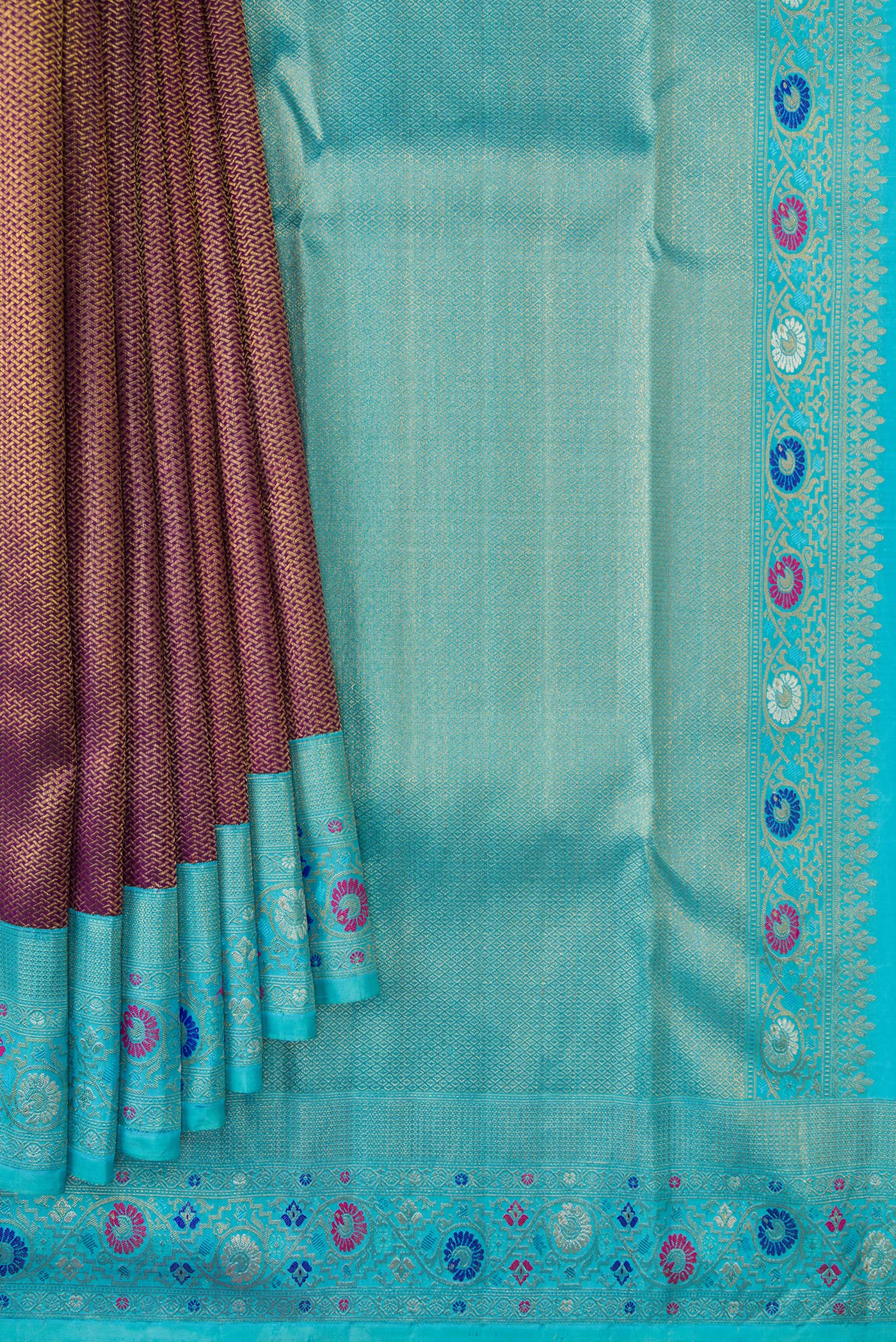 Pleats and pallu of Burgundy Dual Tone Kanjivaram Silk Saree with Zari Brocade on the body and Fancy Border. 
