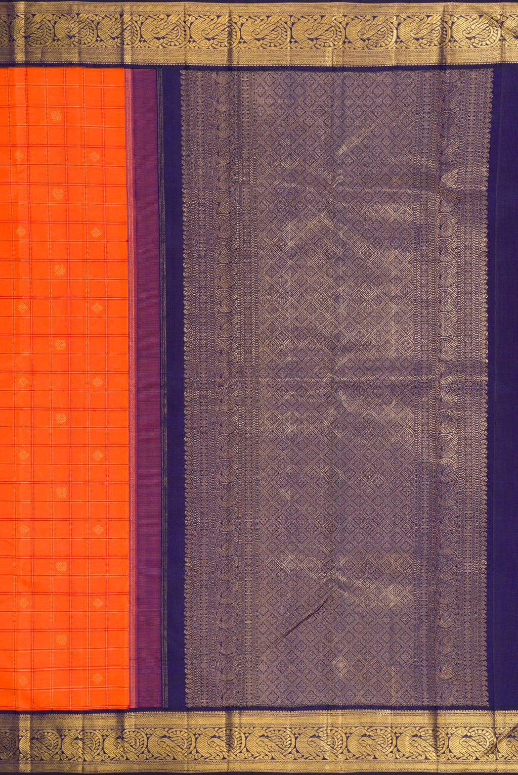 Close up image of the pallu of Pure Silk Pure Zari Orange Dual Tone Kanchipuram Saree with Checked design on the body and Zari Border. 