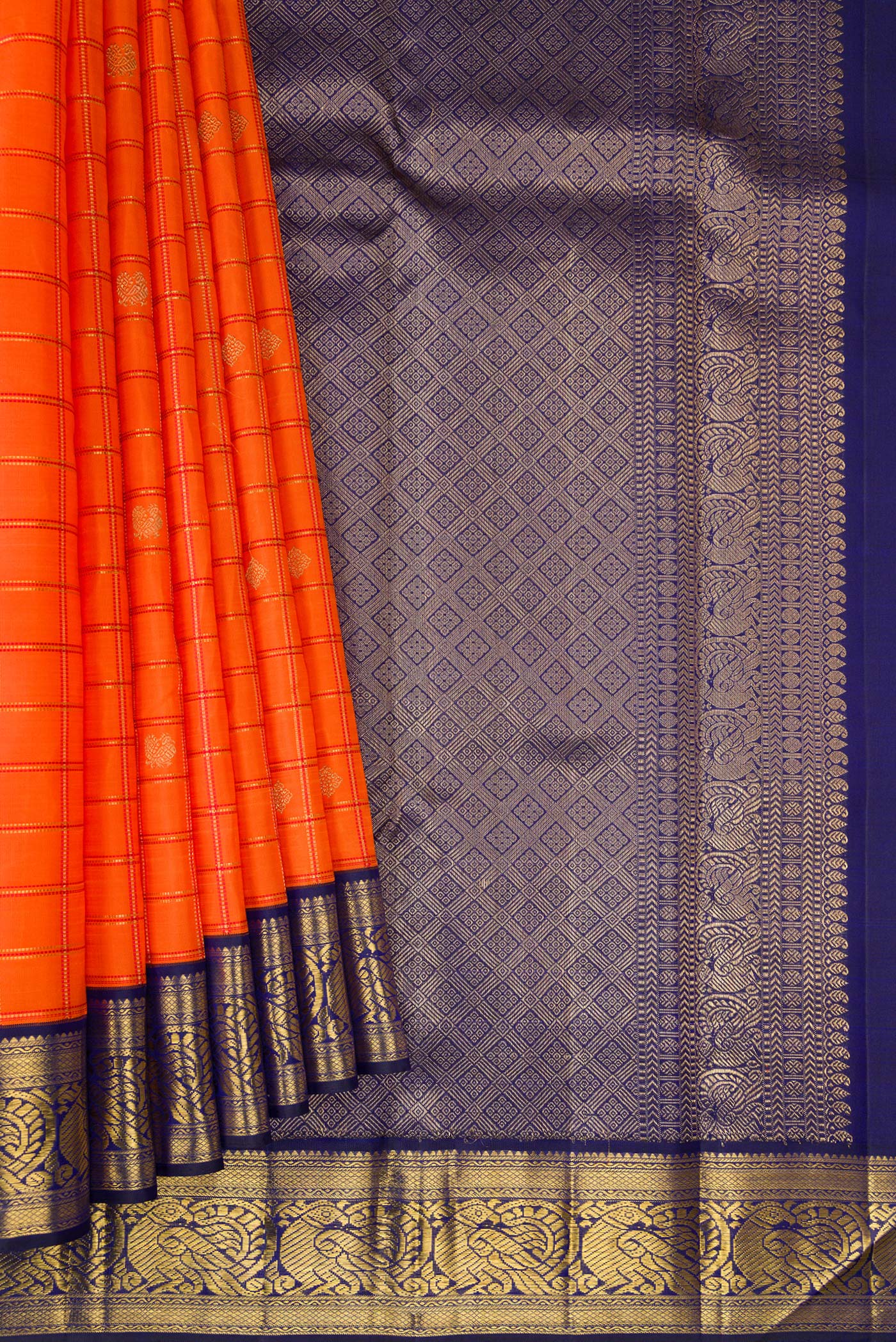 Pleats and pallu of Pure Silk Pure Zari Orange Dual Tone Kanchipuram Saree with Checked design on the body and Zari Border. 