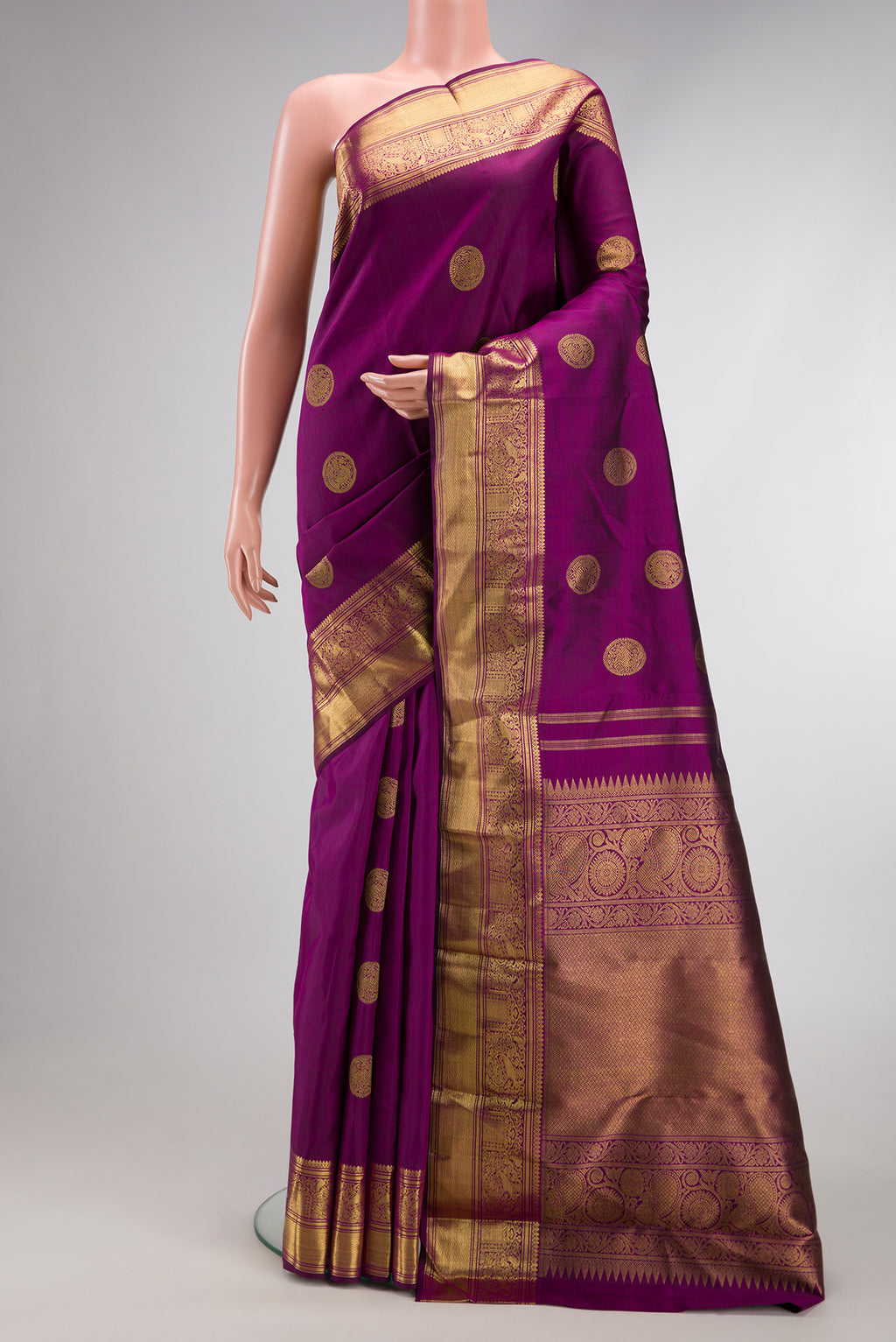 Pure Silk Pure Zari Purple Dual Tone Kanjivaram Saree with Zari Butta on the body and Zari Border.  displayed on a mannequin