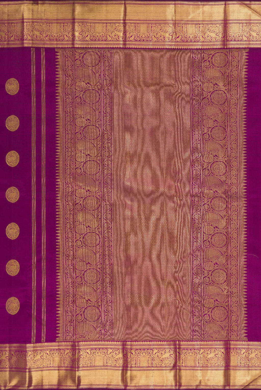Close up image of the pallu of Pure Silk Pure Zari Purple Dual Tone Kanjivaram Saree with Zari Butta on the body and Zari Border. 