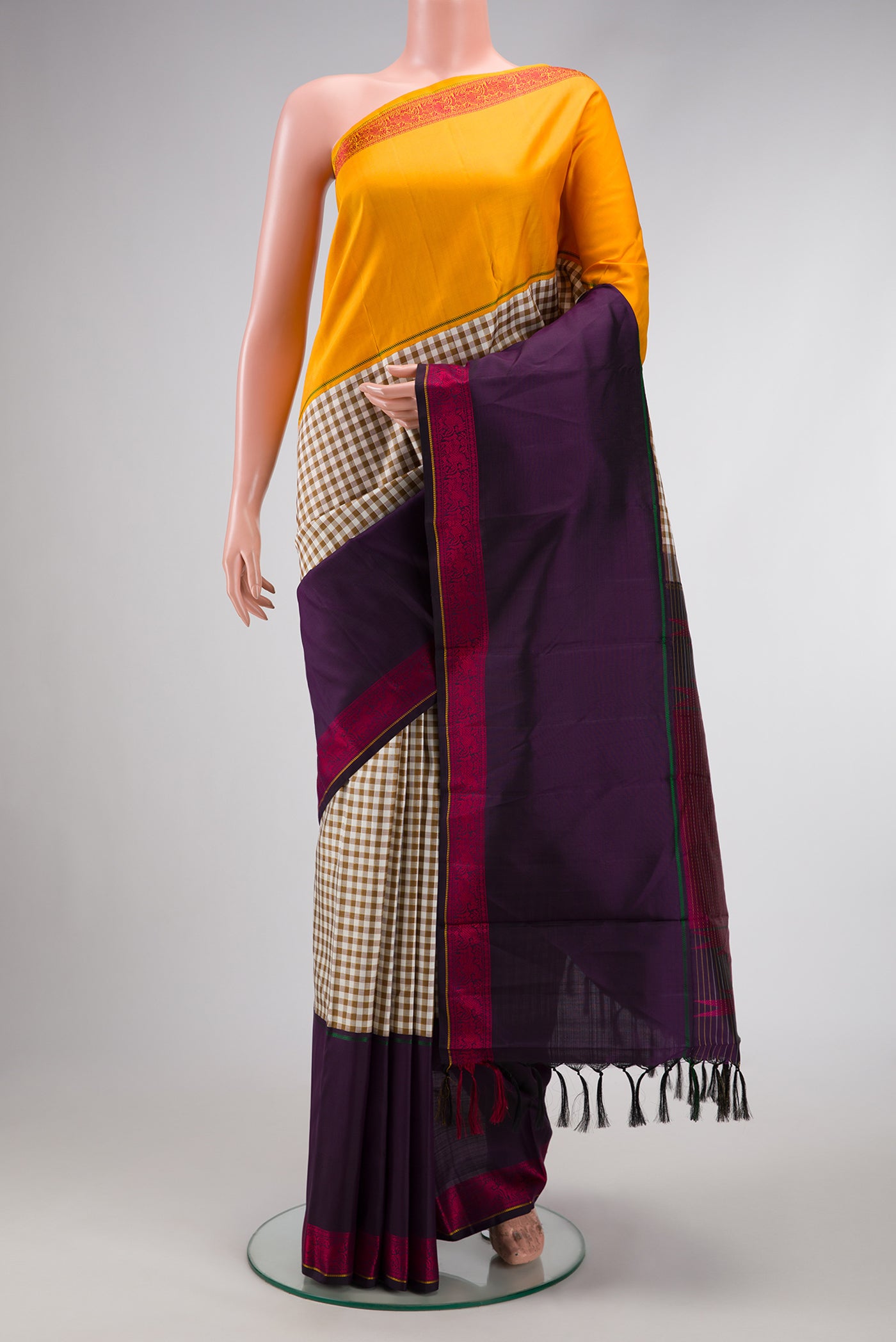 Pure Silk Pure Zari Beige Dual Tone Kanchipuram Saree with Checked design on the body and Ganga Jamuna Border.  displayed on a mannequin