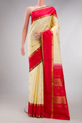 Pure Silk Pure Zari Sandal Dual Tone Kanjivaram Saree with Zari Butta on the body and Fancy Border.  displayed on a mannequin