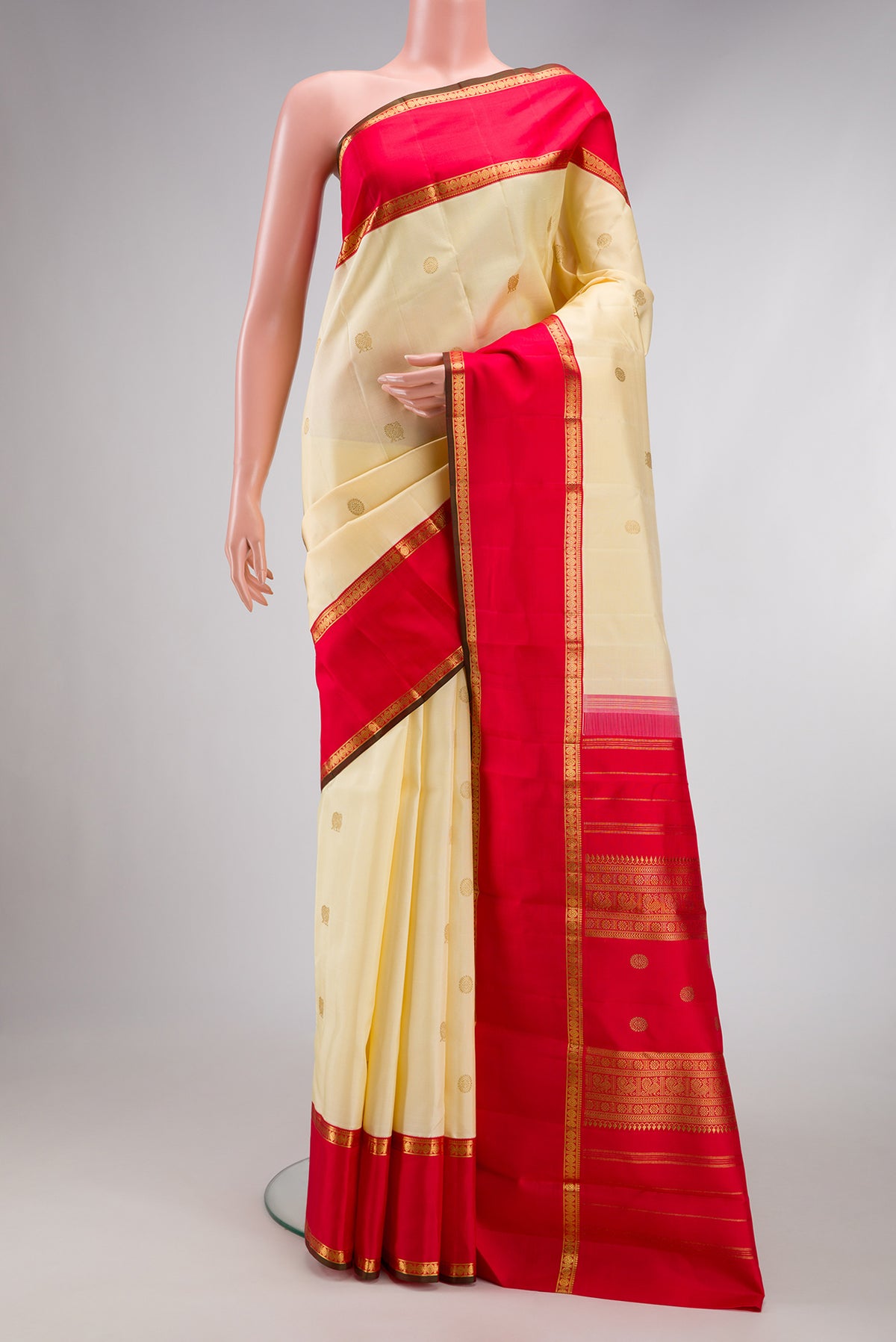 Pure Silk Pure Zari Sandal Dual Tone Kanjivaram Saree with Zari Butta on the body and Fancy Border.  displayed on a mannequin