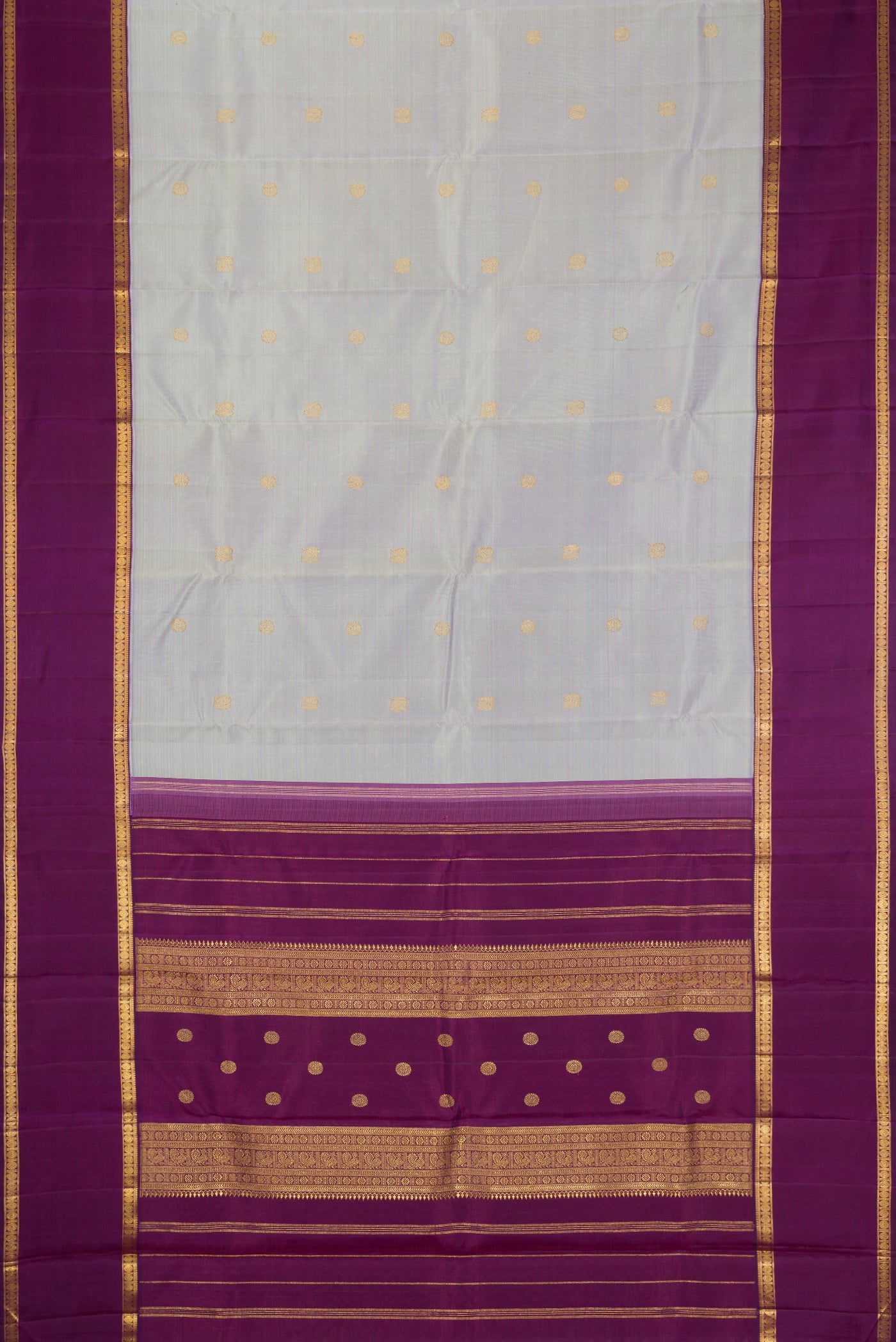Flat view of Pure Silk Pure Zari Light Blue Kanjivaram Saree with Zari Butta on the body and Zari Border. 