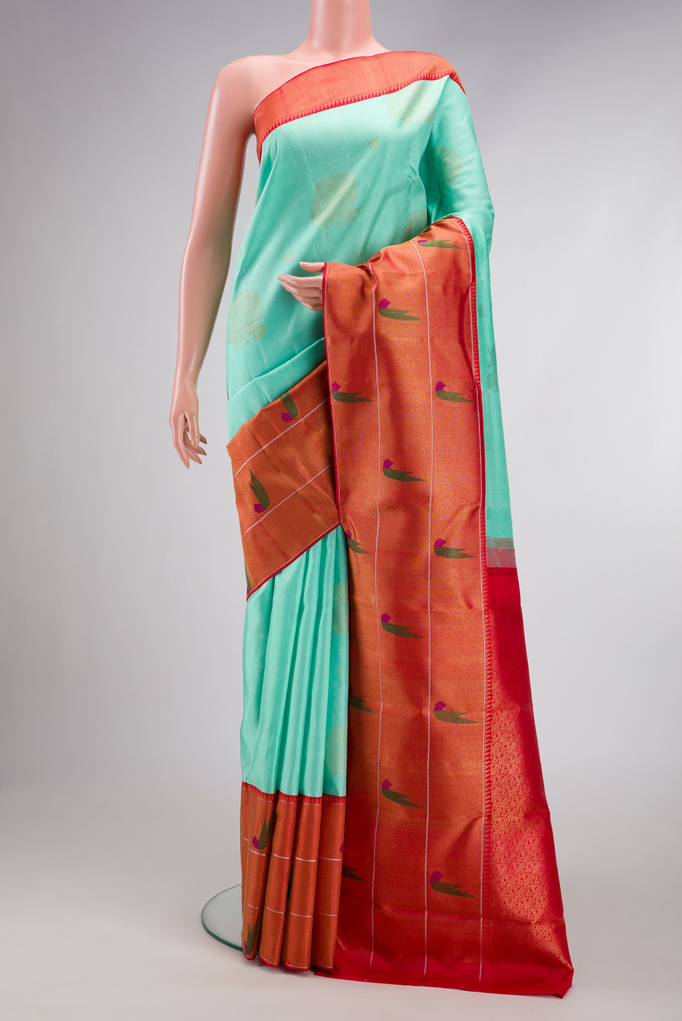 Pure Silk Pure Zari Sea Green Dual Tone Kanjivaram Saree with Zari Butta on the body and Paithani Border.  displayed on a mannequin