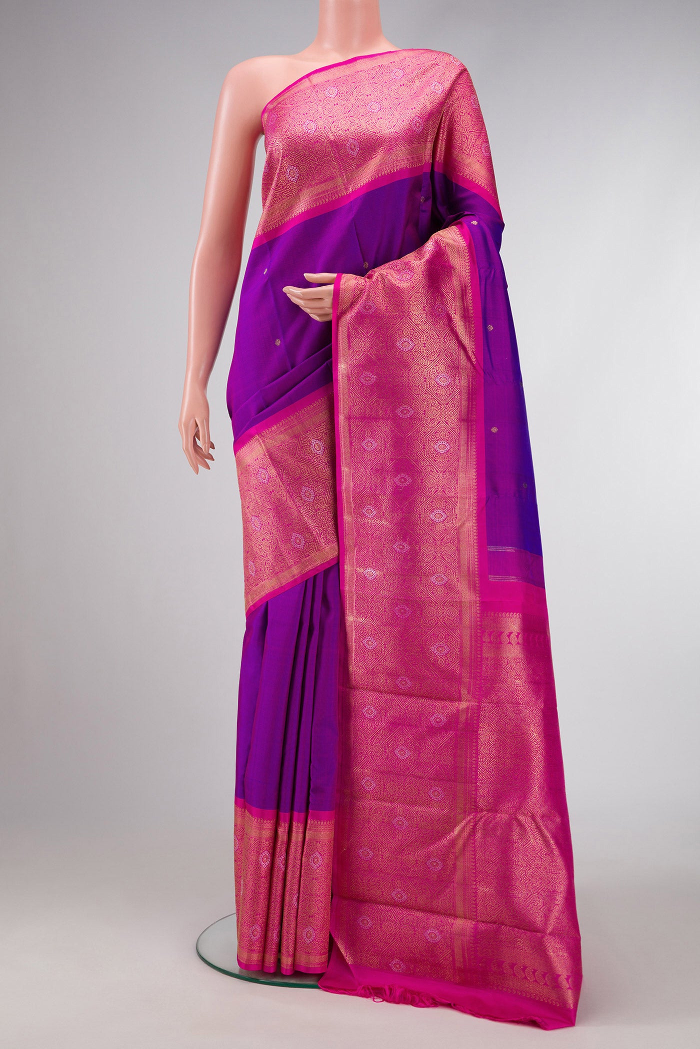 Pure Silk Pure Zari Purple Dual Tone Kanjivaram Saree with Zari Butta on the body and Fancy Border.  displayed on a mannequin